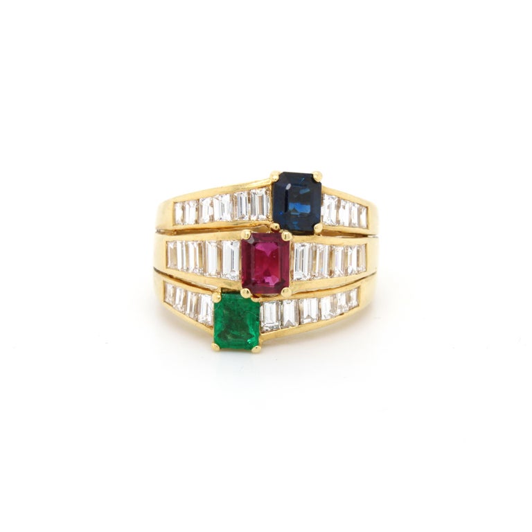 Ruby Sapphire Emerald and Diamond Band Ring by René Kern, ca. 1980s

A very chic and wearable three band ring, each centring bright step cut ruby, sapphire and emerald (ca. 1.5 carats) and beautifully mounted with tapered step cut diamonds (ca. 2