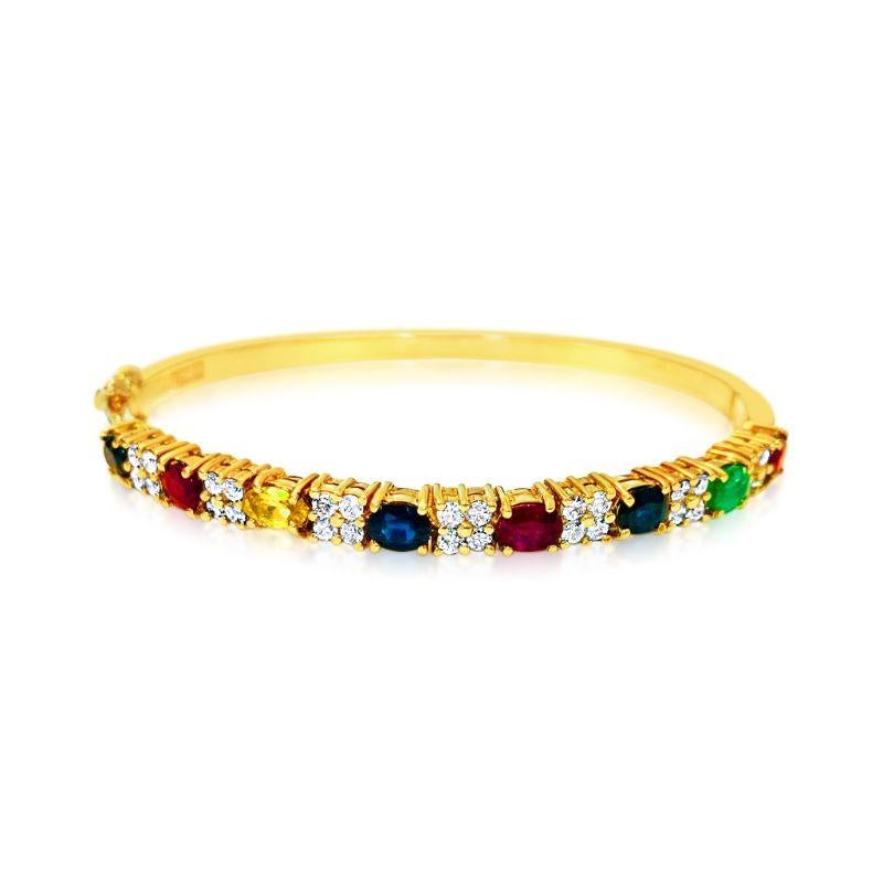 18k yellow gold. 

Precious gemstones: ruby, blue sapphire, yellow sapphire and emerald. 
100% natural earth mined gemstones. Carat weight of each gemstone: 0.75ct. 
Cut: Oval cut gemstones set in prongs. 
Diamonds: 0.80ct total. Round brilliant cut