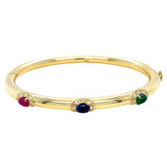 Ruby, Sapphire, Emerald, and Diamond Hinged Oval Bangle in Yellow Gold
