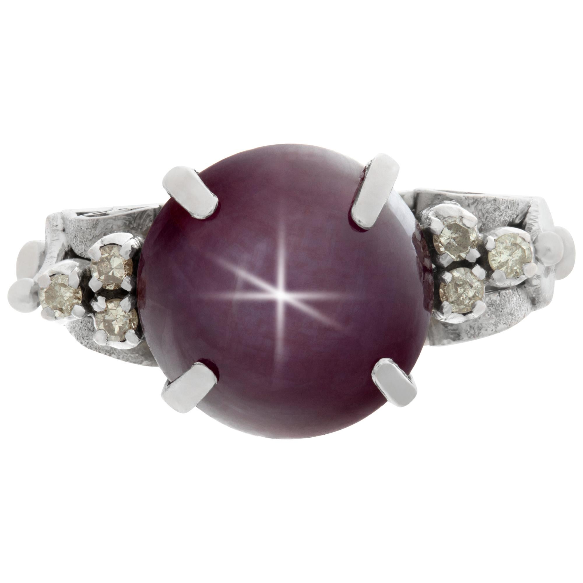 Vintage ruby star sapphire ring in 14k white gold with diamond accents, approximate 4 carat star ruby. Size 5.5, head 11mm x 19mm, shank 3mm.This Ruby ring is currently size 5.5 and some items can be sized up or down, please ask! It weighs 4.9