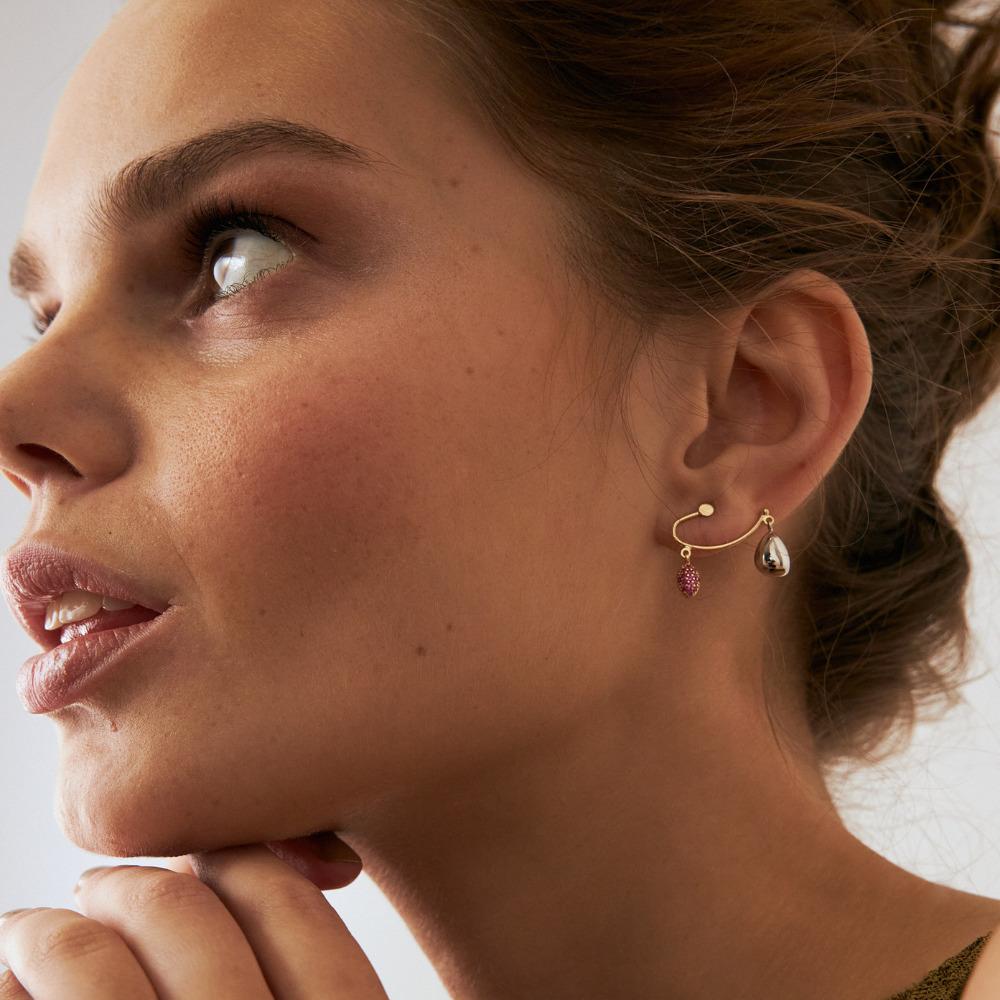 Introducing the Diamond Ruby Stud Earrings in 14K Solid Gold, a manifestation of Orena Jewelry's unwavering commitment to excellence in craftsmanship. Every earring is meticulously hand-forged, emanating a luxurious allure seamlessly merged with
