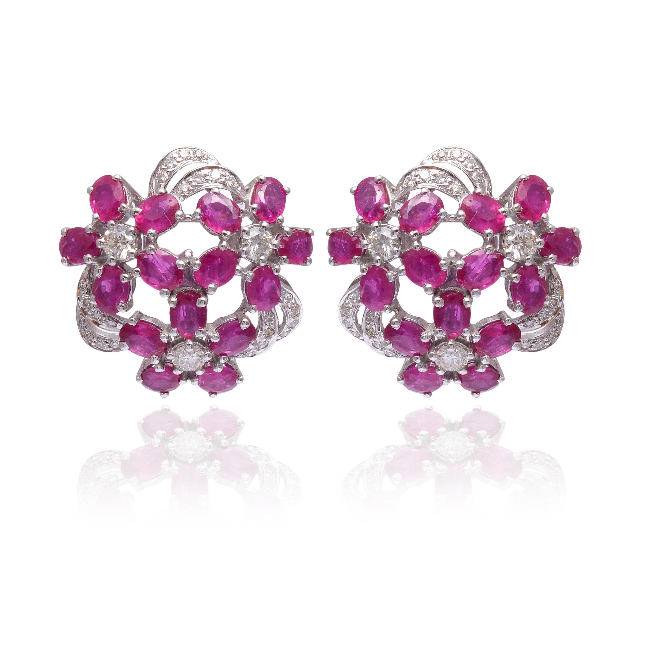 These earrings are made with Ruby gemstones and diamond. They are set in 18K gold. Shine all day long in this delicate pair of stud earrings. Perfect for gifting, they twinkle with timeless elegance. Easy to mix and match with other jewellery