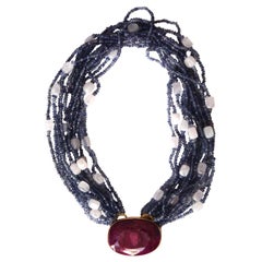 Collana in oro 18 carati con rubino, tanzanite e quarzo rosa