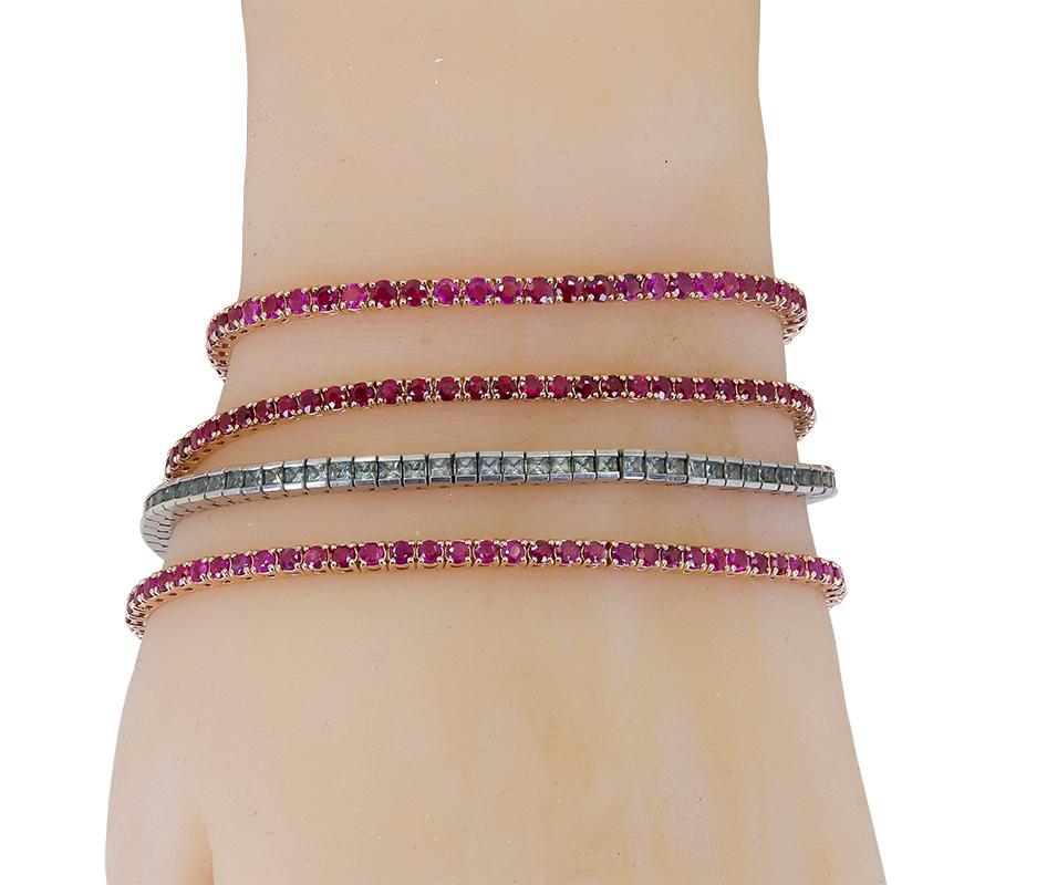 A 14K rose gold tennis bracelet, set with 67 round 2.3 mm Burma color rubies, that have a total approximate weight of 5.50 cts. This item is part of our stackable collection, beautiful on it's own and magnificent with other bracelets from our