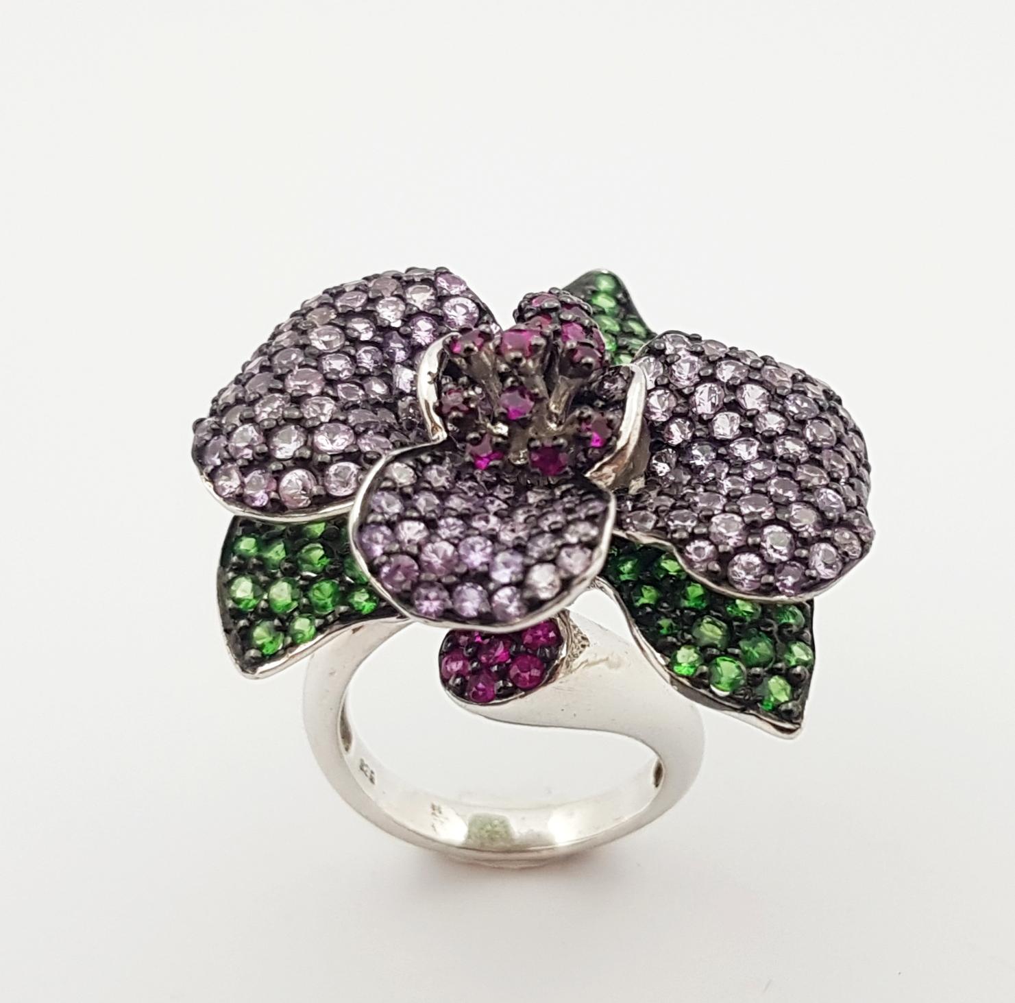 Ruby, Tsavorite and Pink Sapphire Ring set in Silver Settings

Width:  3.9 cm 
Length: 3.5 cm
Ring Size: 55
Total Weight: 17.92 grams

*Please note that the silver setting is plated with rhodium to promote shine and help prevent oxidation.  However,