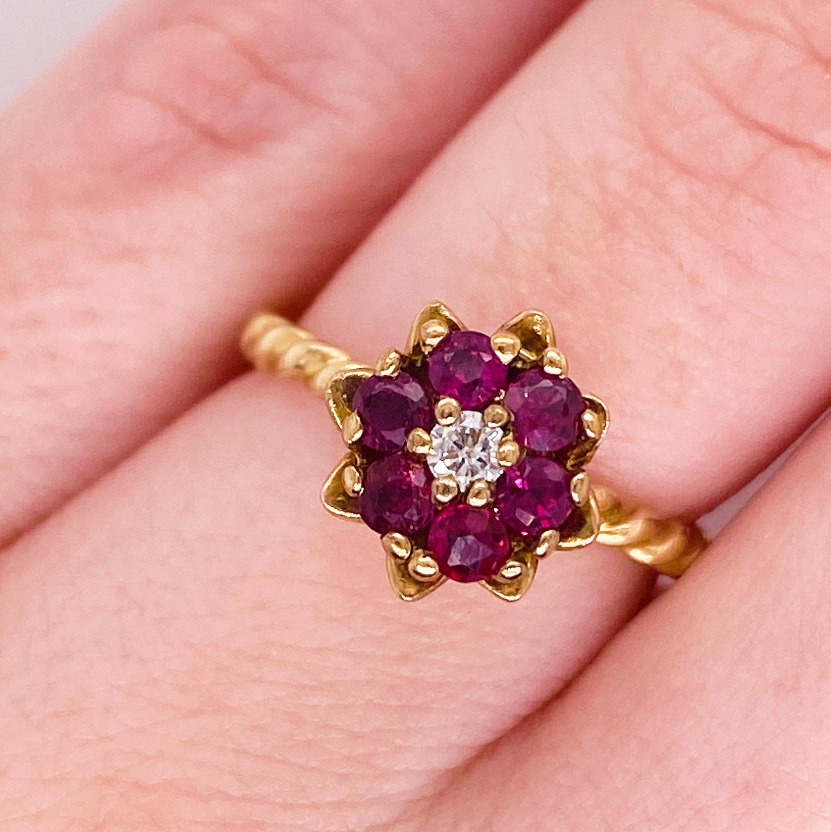 The adorable ruby and diamond tulip ring is a classic flower design that has been worn for generations. This dainty fine jewelry piece is made with genuine round ruby gemstones and a natural round brilliant diamond. The flower design has deep