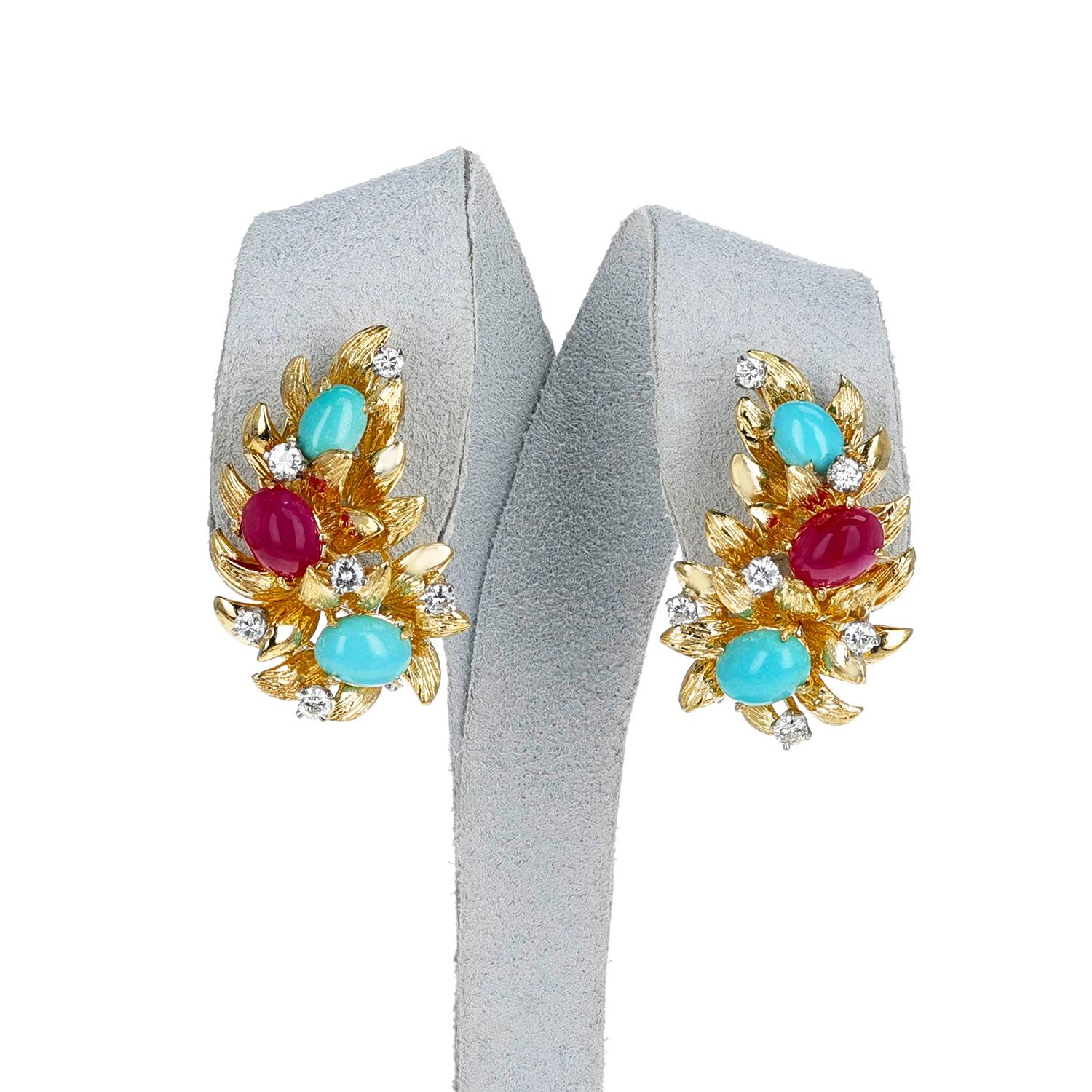 A pair of Ruby, Turquoise and Diamond Gold Leaf Earrings made in 18k Gold. The ruby cabochons weigh appx. 3 carats and the diamonds weigh appx. 0.60 carats. The total weight of the earring is 23.24 grams. The length is 1.20 inches. 