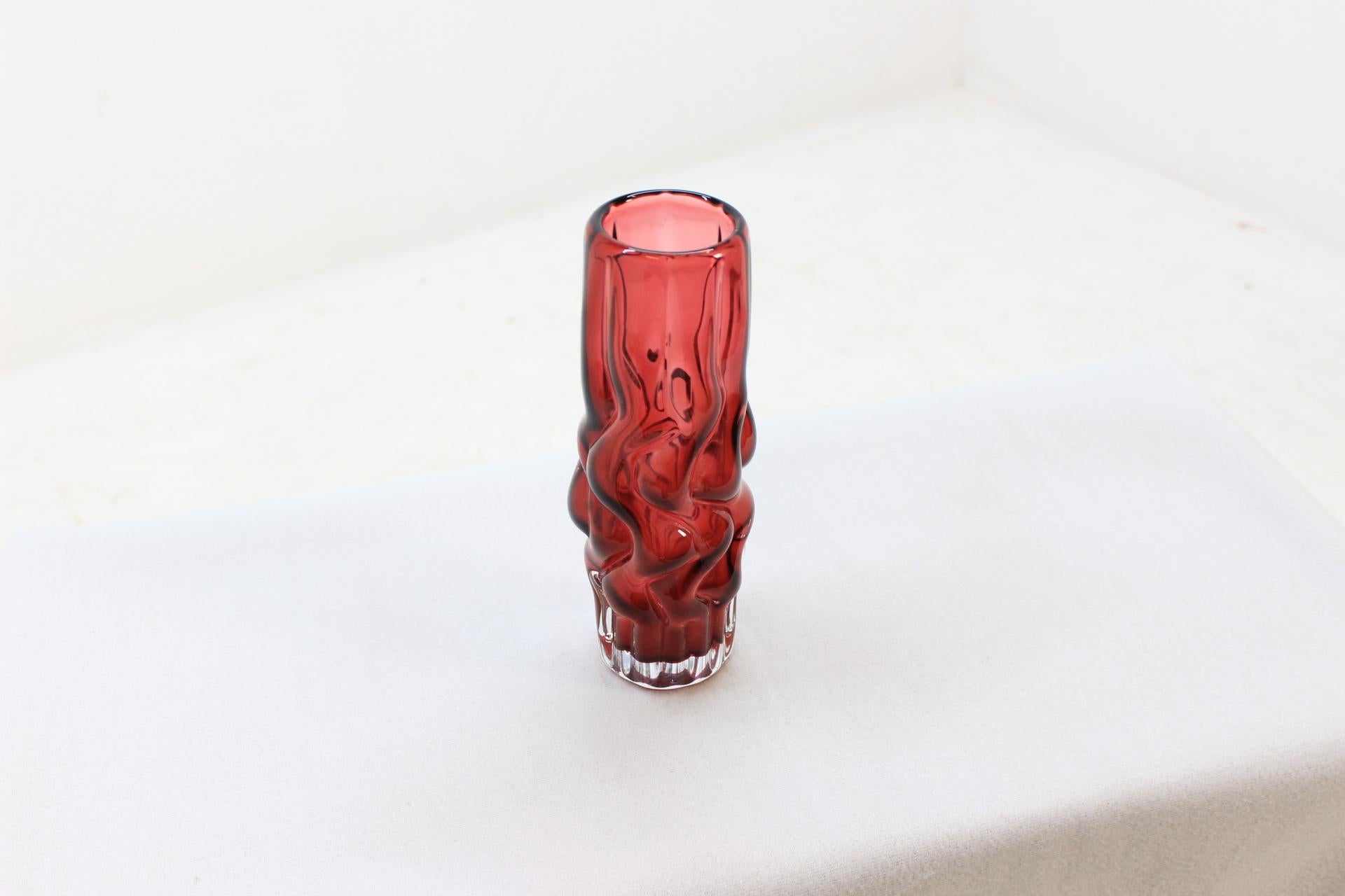 Vase was designed by Pavel Hlava in 1968 for Borse Glass. The item made of ruby compactly shaped glass. Decor is known in collector's slang as 