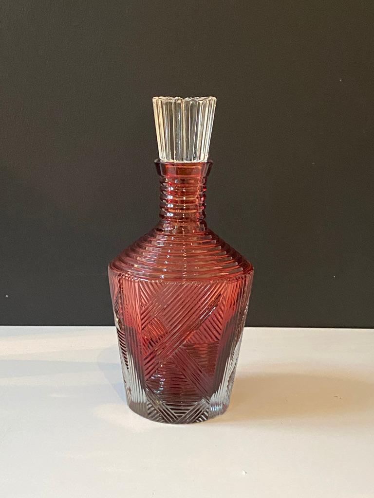The mouth blown and hand carved ruby glass whiskey carafe is inspired from the turn of the century designs and comes with a clear hand-sculpted stopper.
Fy-shan Glass Studio seeks to create timeless pieces that represent the everlasting use of