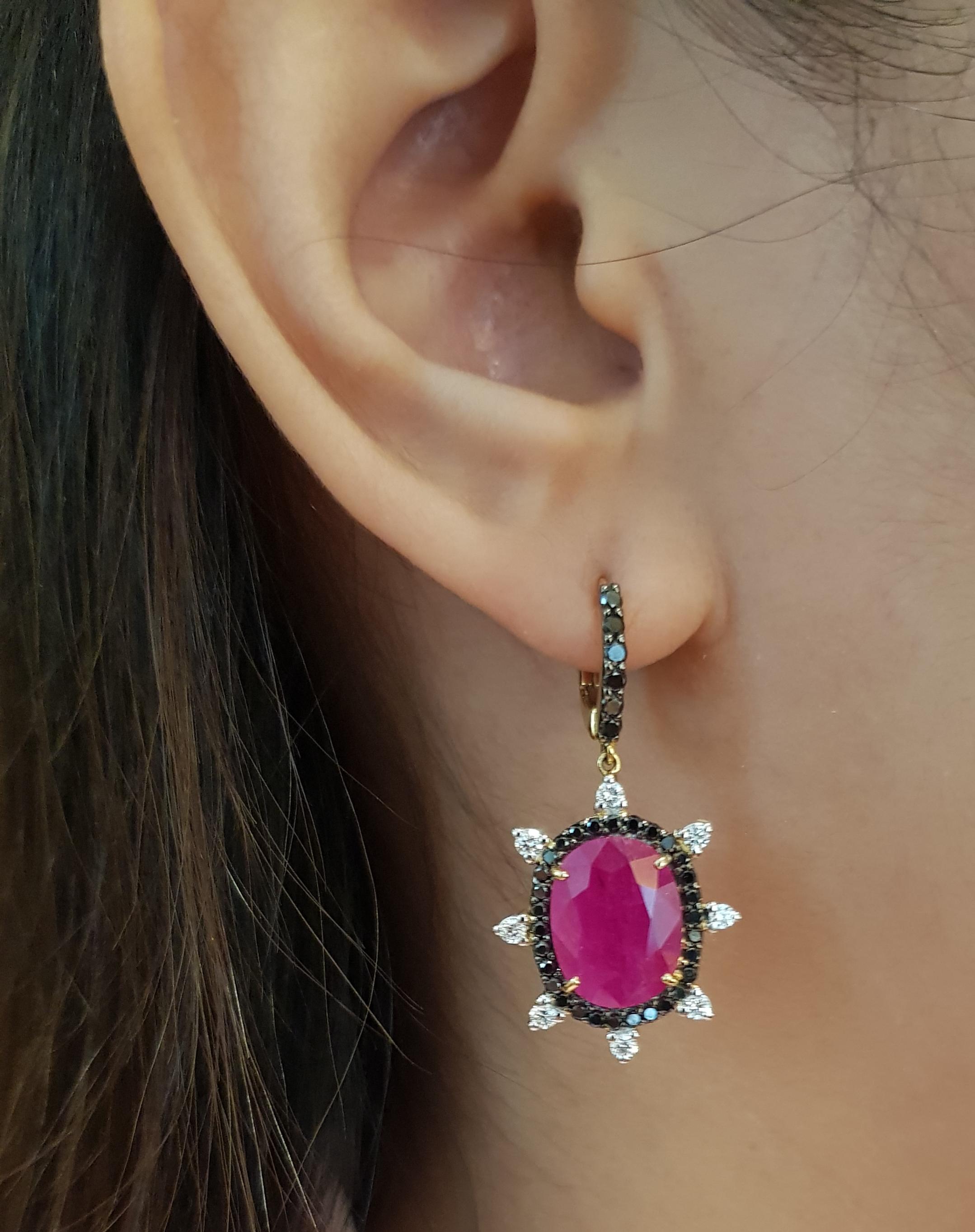 Ruby 9.34 carats with Black Diamond 0.85 carat and Diamond 0.44 Earrings set in 18 Karat Gold Settings

Width:  1.8 cm 
Length:  3.4 cm
Total Weight: 8.95 grams

