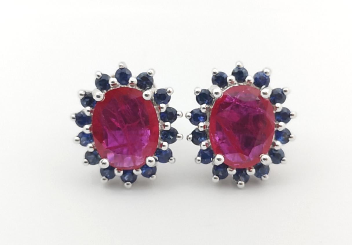 Women's Ruby with Blue Sapphire Earrings set in 14K White Gold Settings For Sale