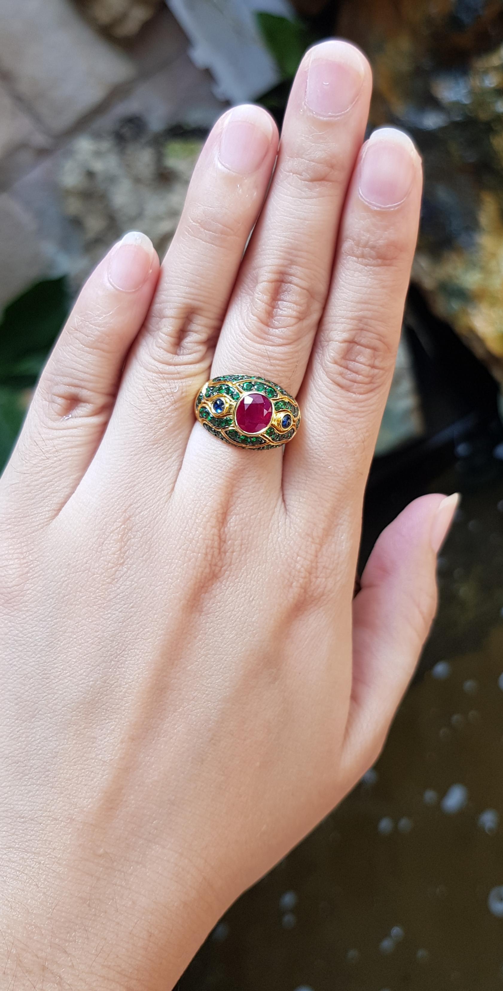 Ruby 2.01 carats with Cabochon Blue Sapphire 0.27 and Tsavorite 1.23 carats Ring set in 18 Karat Gold Settings

Width:  1.5 cm 
Length: 1.3 cm
Ring Size: 50
Total Weight: 5.98 grams

