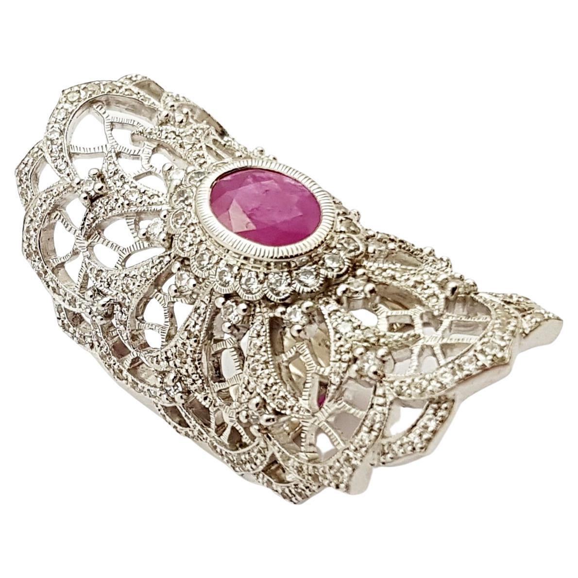 Ruby 1.51 carats with Cubic Zirconia Ring set in Silver Settings

Width:  2.0 cm 
Length: 4.2 cm
Ring Size: 55
Total Weight: 20.65 grams

*Please note that the silver setting is plated with rhodium to promote shine and help prevent oxidation. 
