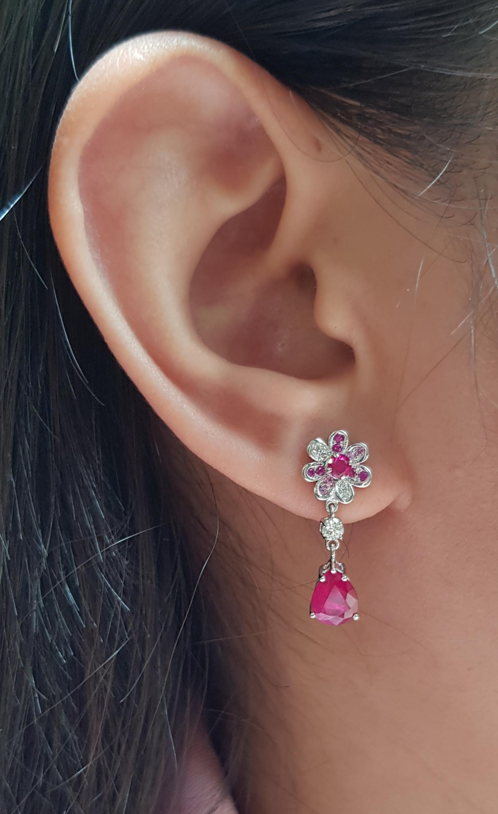 Ruby 2.27 carats with Diamond 0.08 carat, Ruby 0.40 carat and Pink Sapphire 0.20 carat Earrings set in 18 Karat White Gold Settings

Width:  0.9 cm 
Length: 2.3 cm
Total Weight: 3.38 grams

