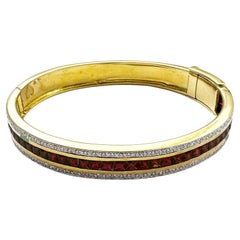 Ruby with Diamond Bangle set in 18K Gold Settings