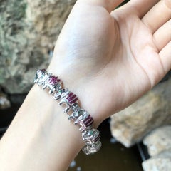 Bracciale di rubini e diamanti con montatura in oro bianco 18 carati
