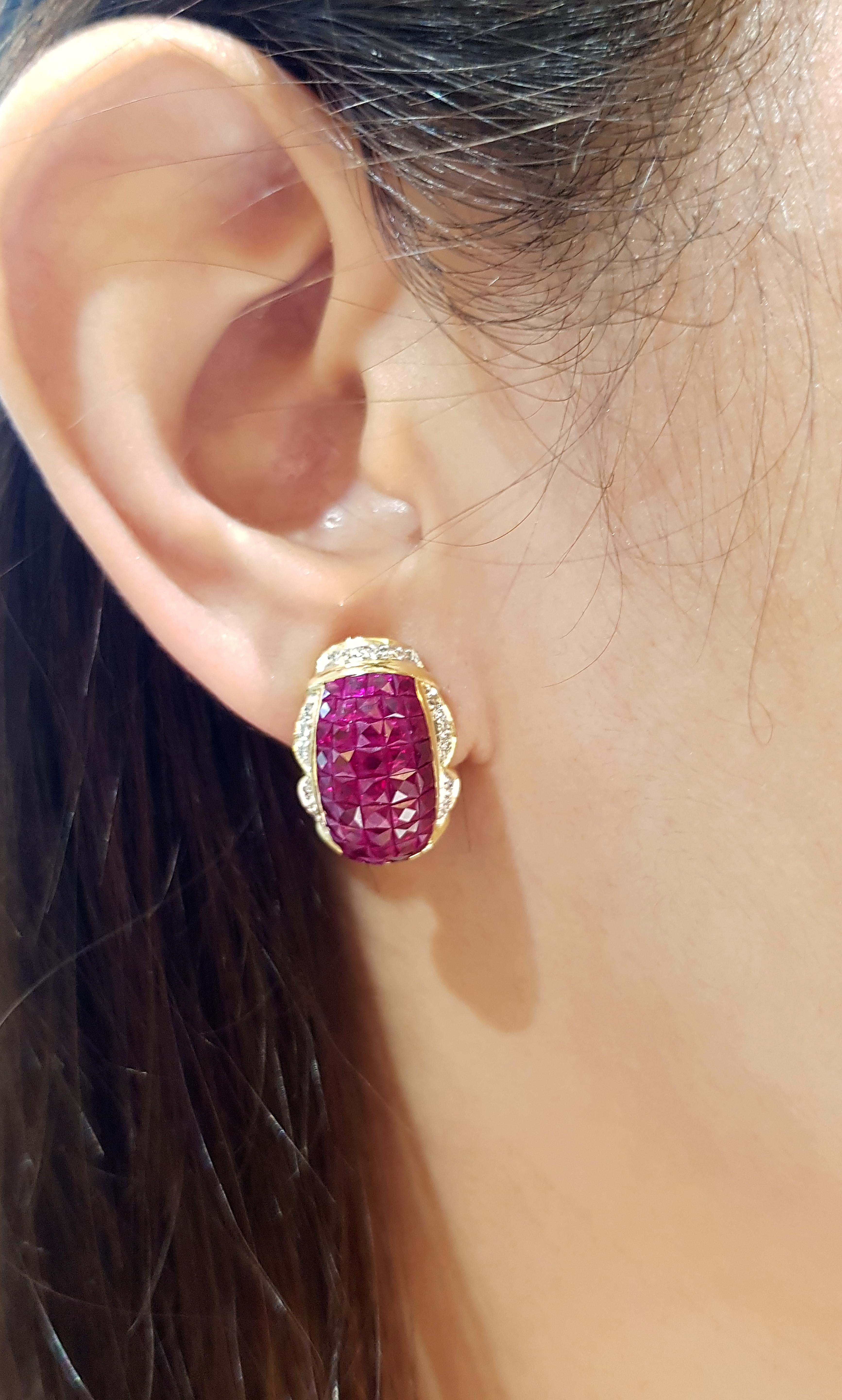 Ruby 8.90 carats with Diamond 0.28 carat Earrings set in 18 Karat Gold Settings

Width:  1.2 cm 
Length: 1.8 cm
Total Weight: 12.72 grams

