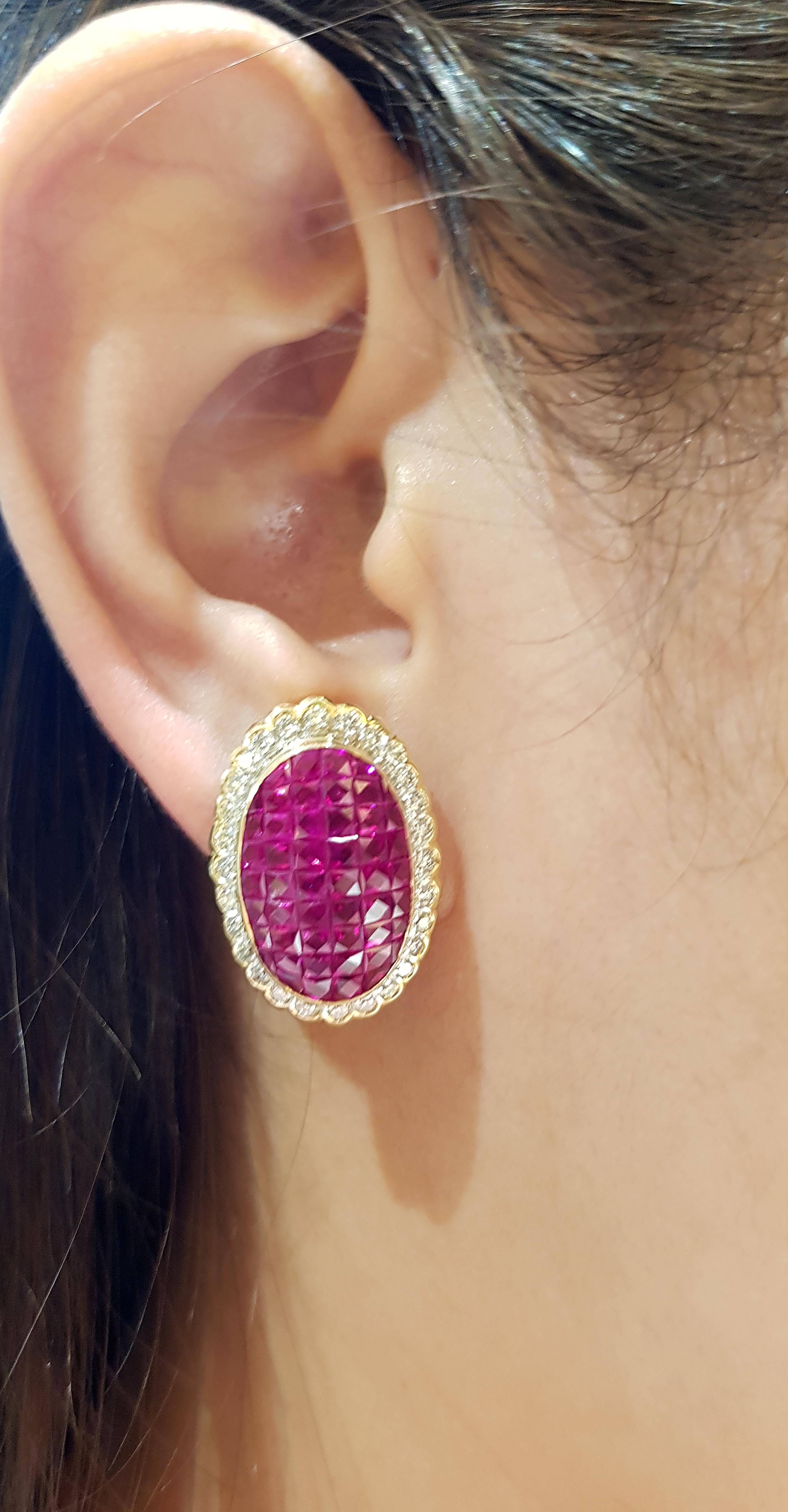 Ruby 7.85 carats with Diamond 0.99 carat Earrings set in 18 Karat Gold Settings

Width:  1.7 cm 
Length: 2.4 cm
Total Weight: 12.23 grams

