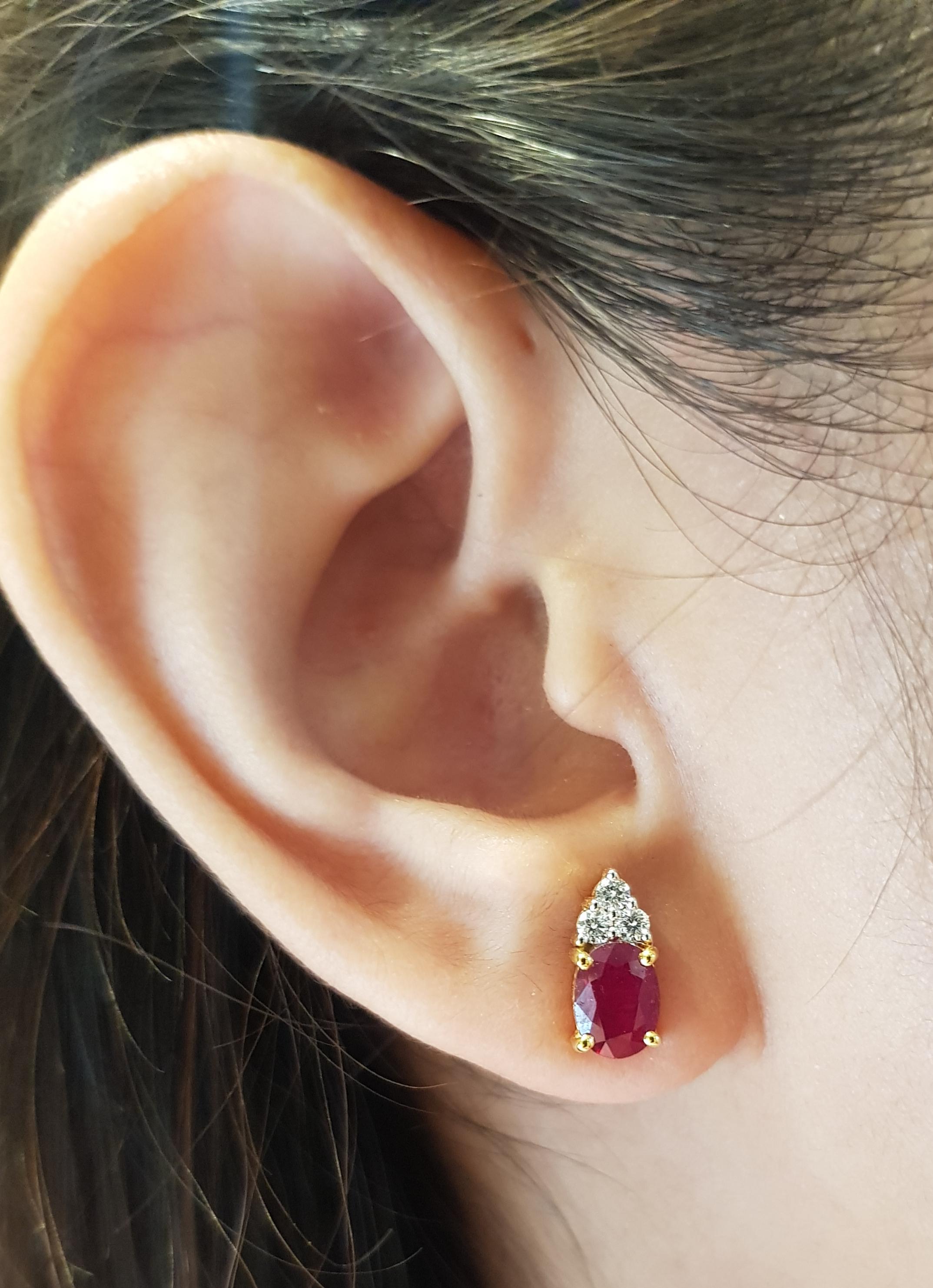 Ruby 1.06 carats with Diamond 0.07 carat Earrings set in 18 Karat Gold Settings

Width:  0.4 cm 
Length:  0.9 cm
Total Weight: 2.71 grams

