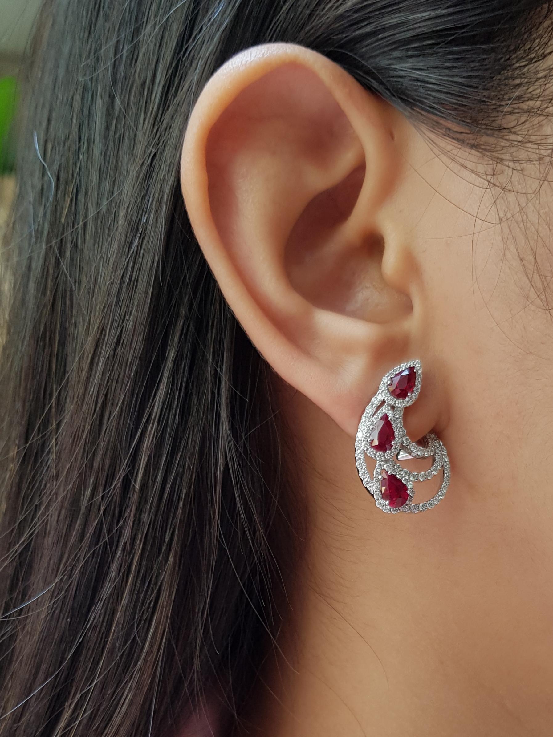 Ruby 2.77 carats with Diamond 1.25 carats Earrings set in 18 Karat White Gold Settings

Width: 1.8 cm
Length: 2.5 cm 

