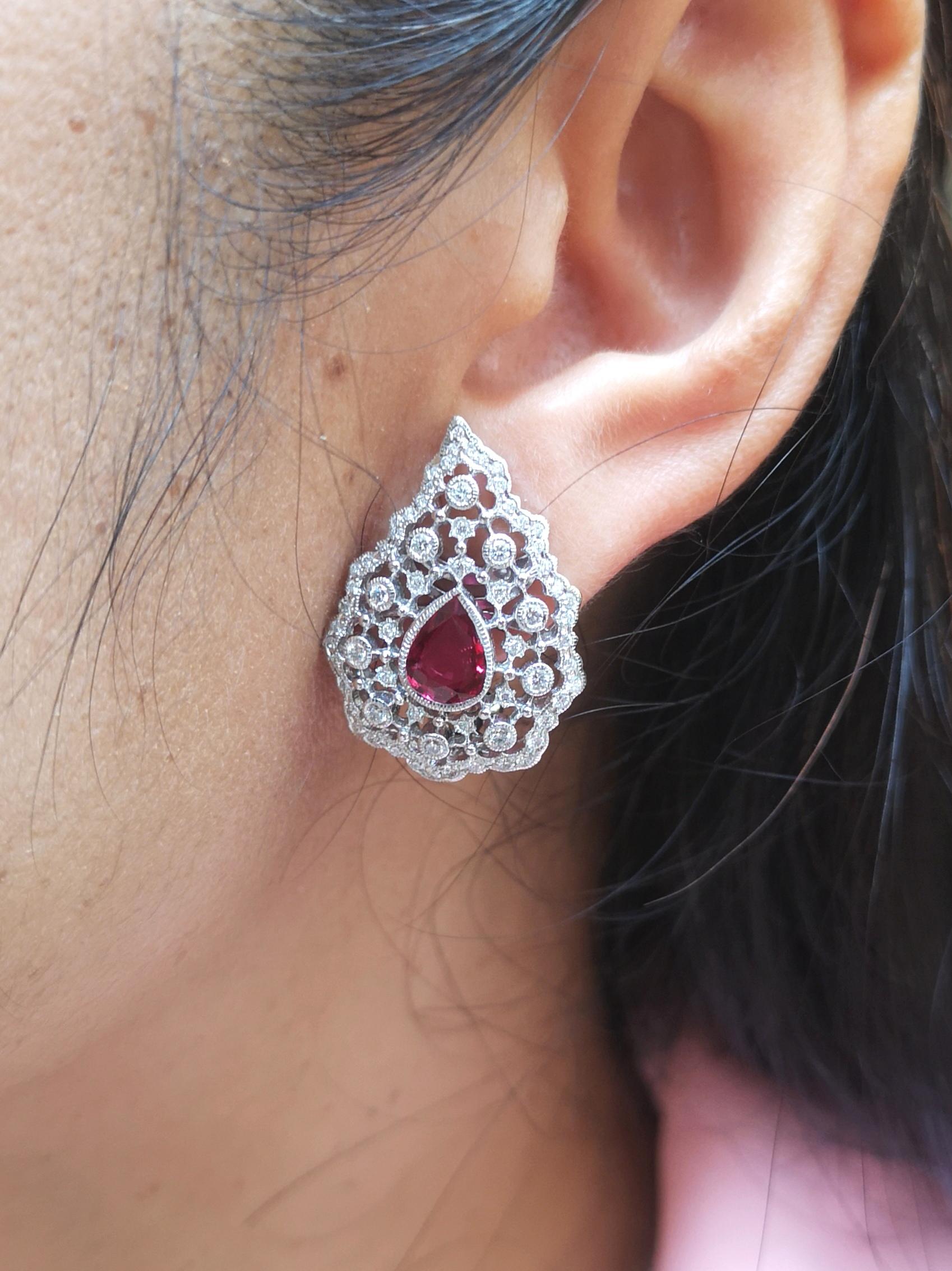 Ruby 2.93 carats with Diamond 0.95 carat Earrings set in 18 Karat White Gold Settings

Width:  2.0 cm 
Length: 2.8 cm
Total Weight: 13.2 grams

