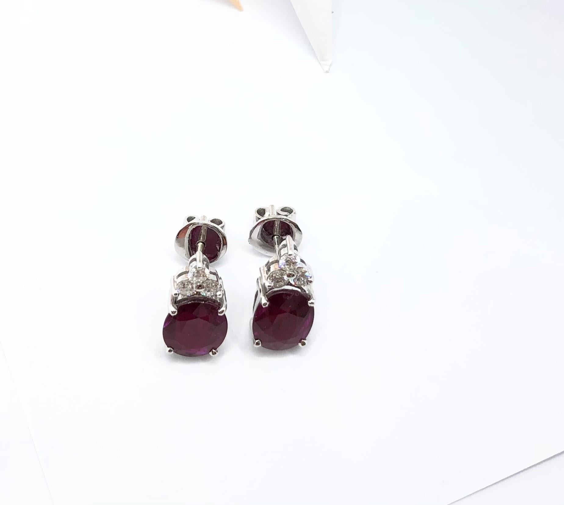 Women's Ruby with Diamond Earrings Set in 18 Karat White Gold Settings For Sale