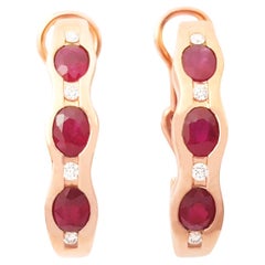 Boucles d'oreilles en or rose 18 carats avec rubis et diamants