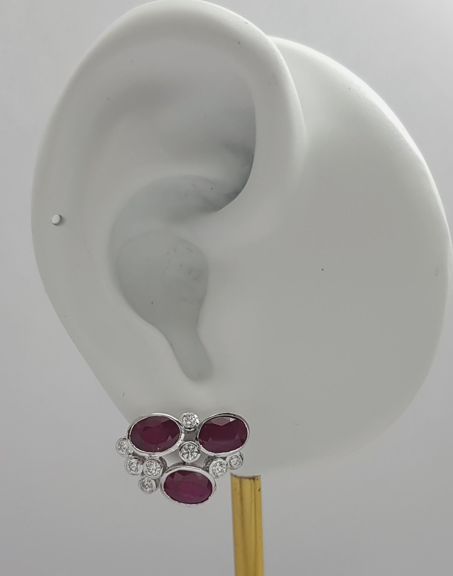 Ruby 5.58 carats with Diamond 0.62 carat Earrings set in 18K White Gold Settings

Width: 1.2 cm 
Length: 1.8 cm
Total Weight: 6.98 grams

