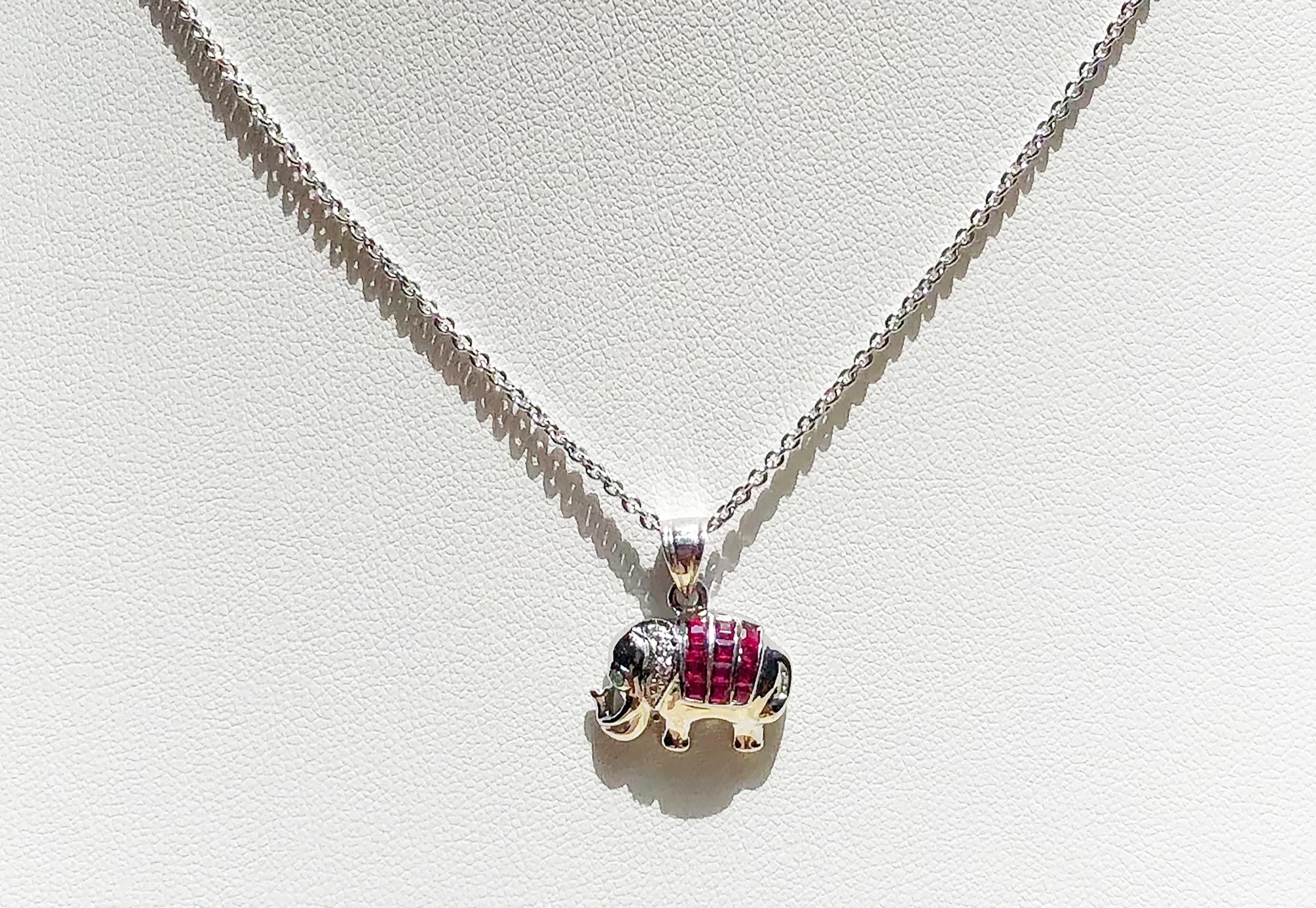 Ruby 0.42 carat with Diamond 0.02 carat Elephant pendant set in 18 Karat White Gold Settings
(chain not included)

Width:  1.7 cm 
Length: 1.8 cm
Total Weight: 2.35 grams

