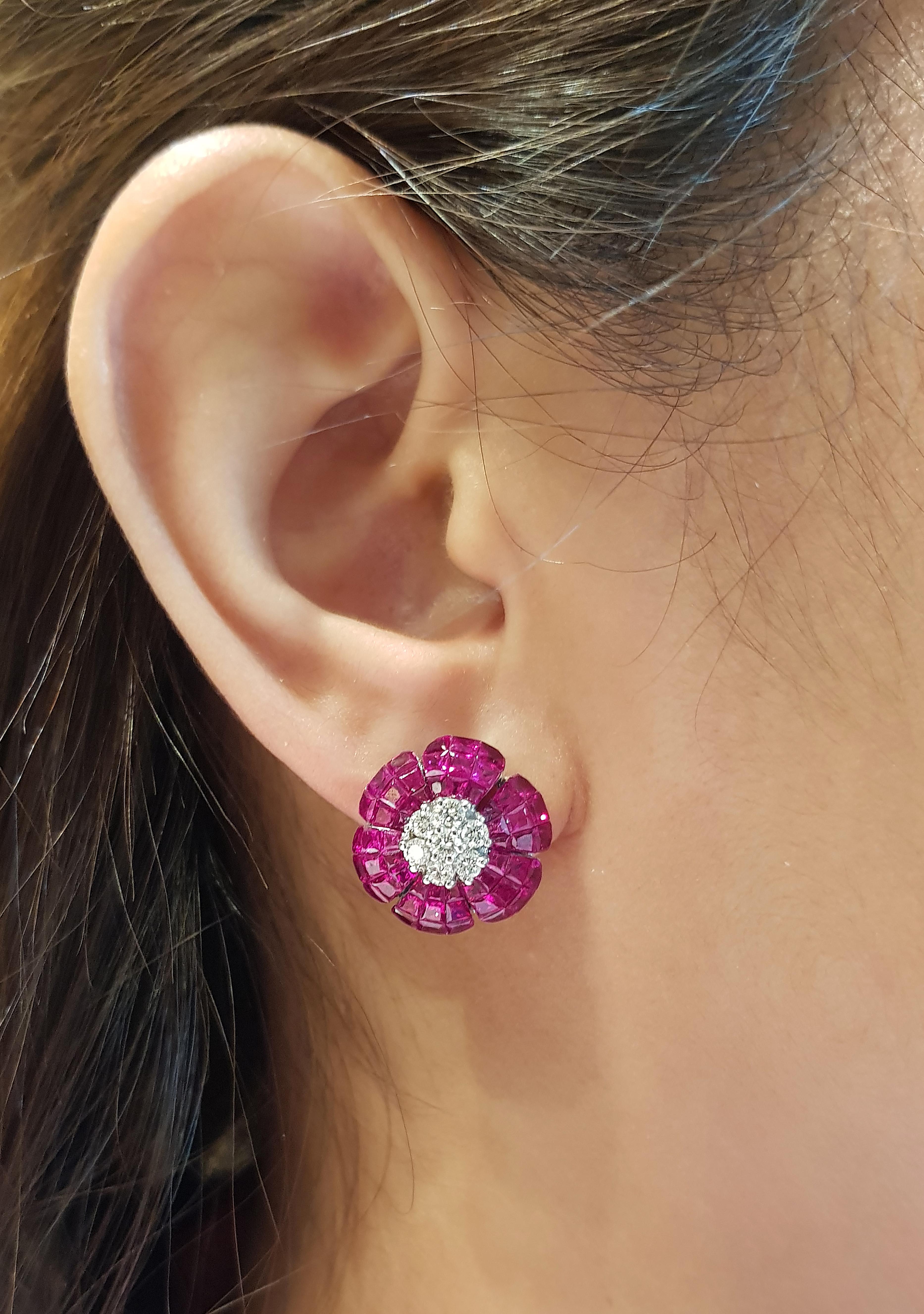 Ruby 13.60 carats with Diamond 0.60 carat Earrings set in 18 Karat White Gold Settings

Width:  1.6 cm 
Length: 1.6 cm
Total Weight: 12.32 grams

