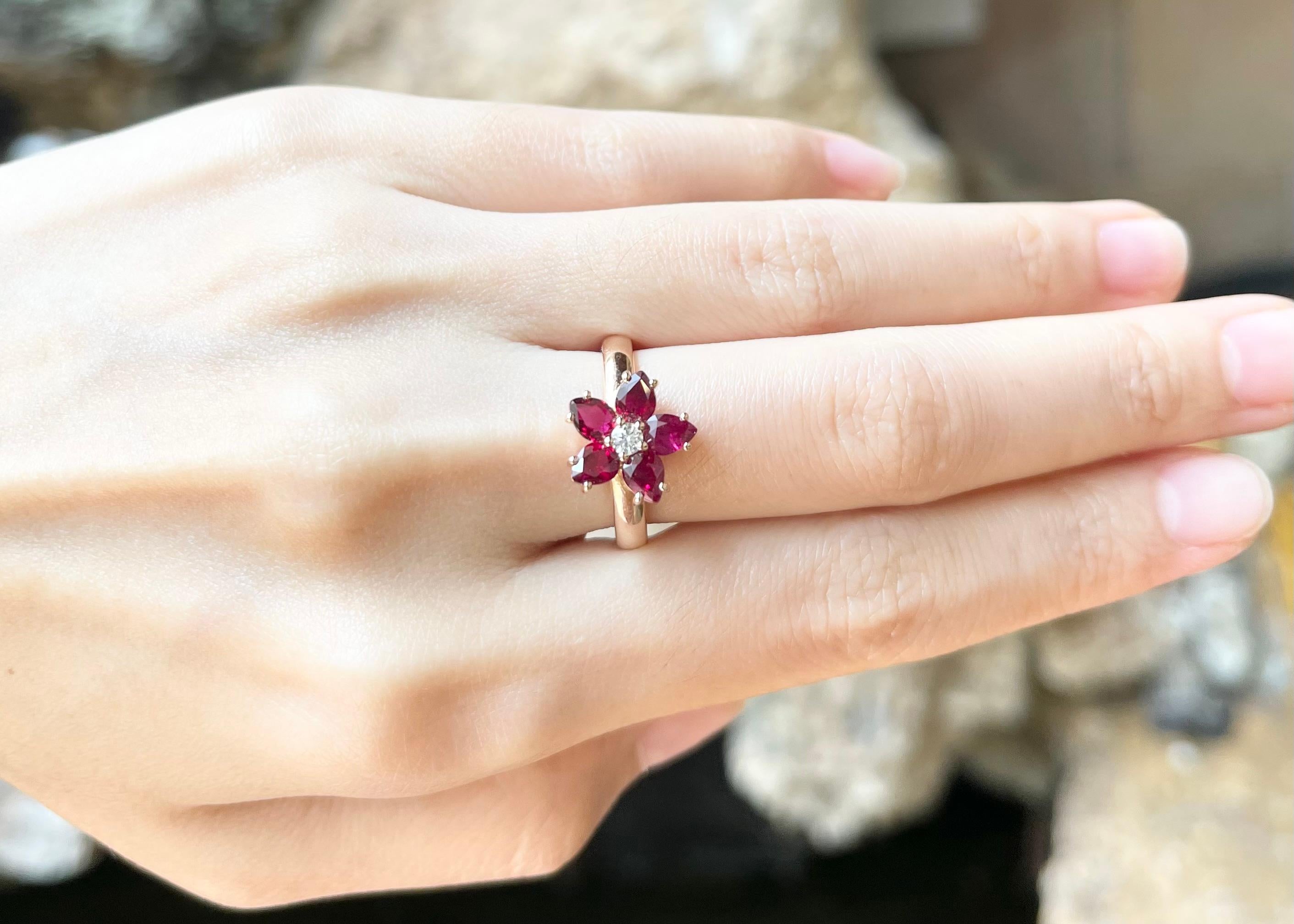 Contemporary Ruby with Diamond Flower Ring set in 18K Rose Gold Settings For Sale