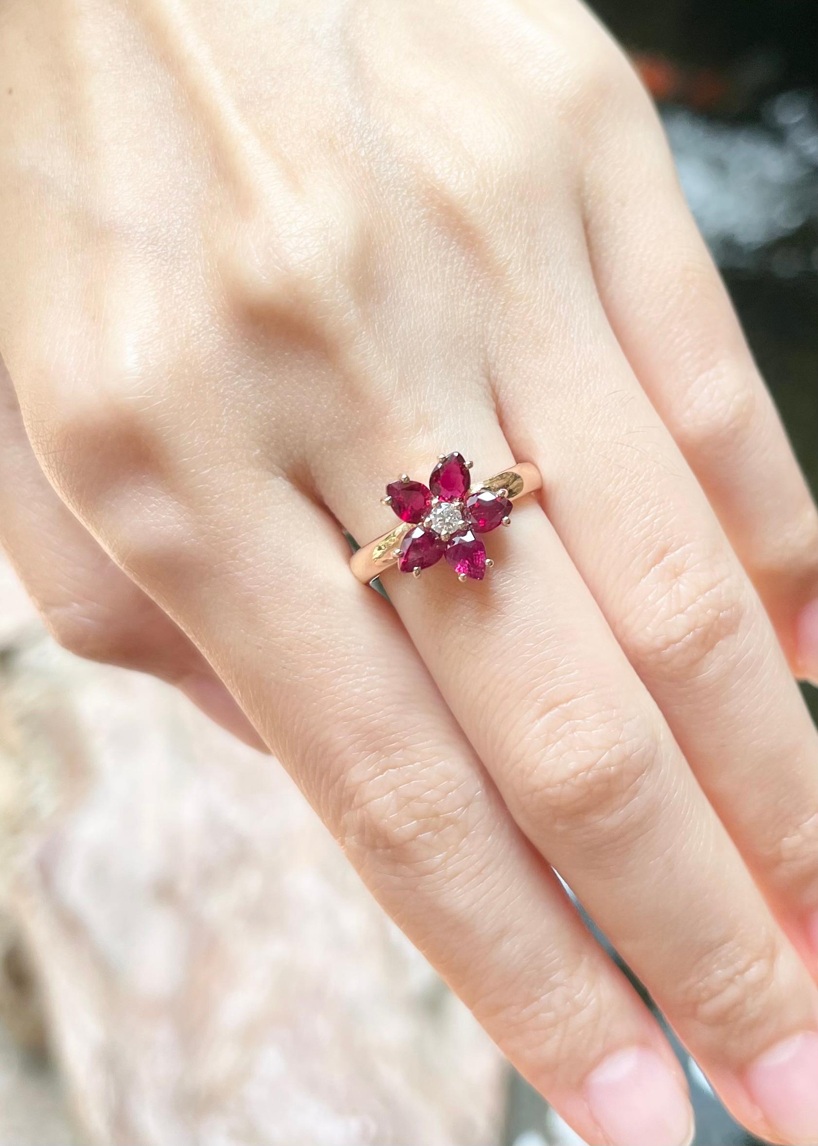 Pear Cut Ruby with Diamond Flower Ring set in 18K Rose Gold Settings For Sale