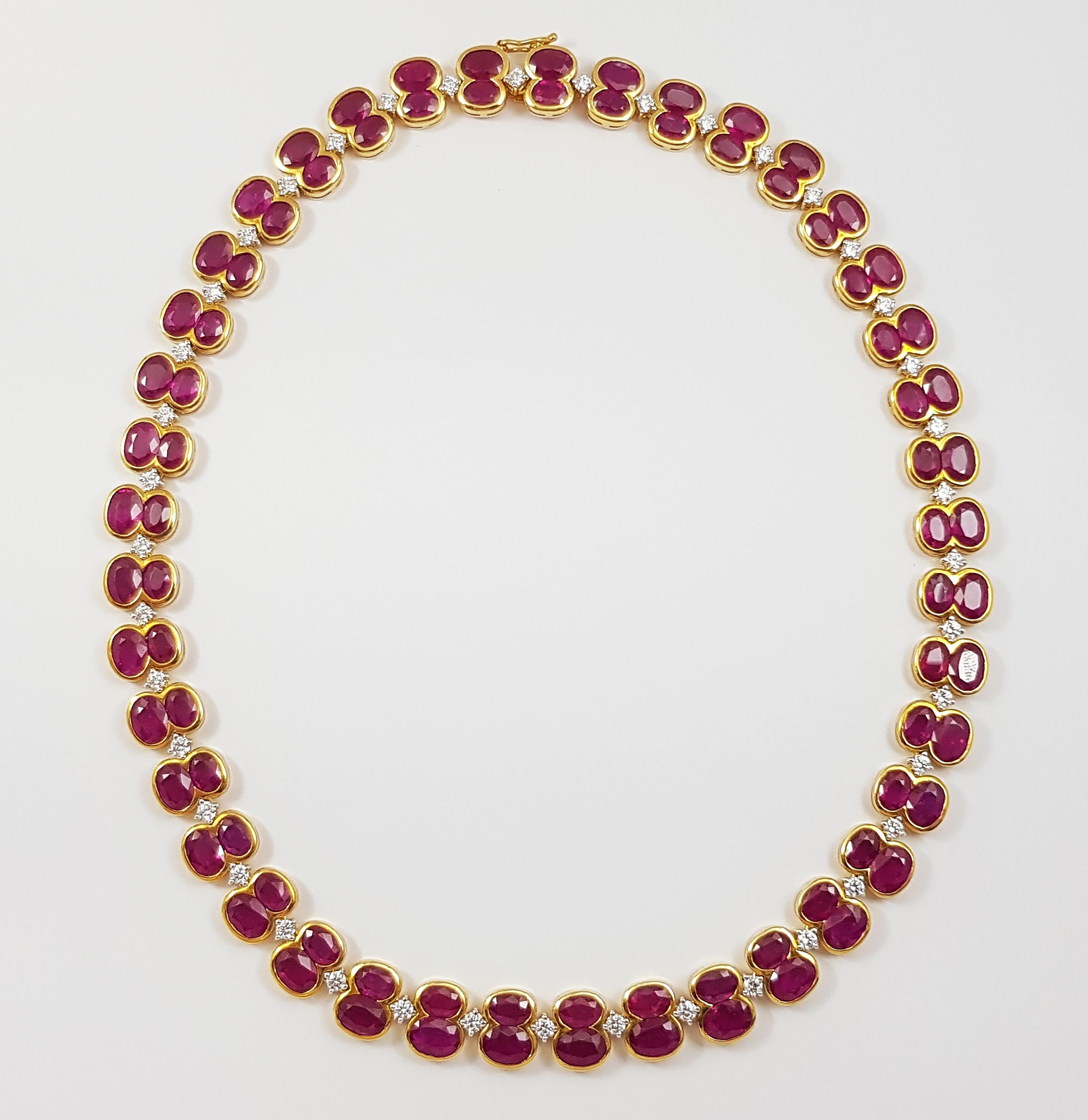 Ruby 65.2 carats with Diamond 2.82 carats Necklace set in 18 Karat Gold Settings

Width:  1.1 cm 
Length: 40.6 cm
Total Weight: 67.0 grams

