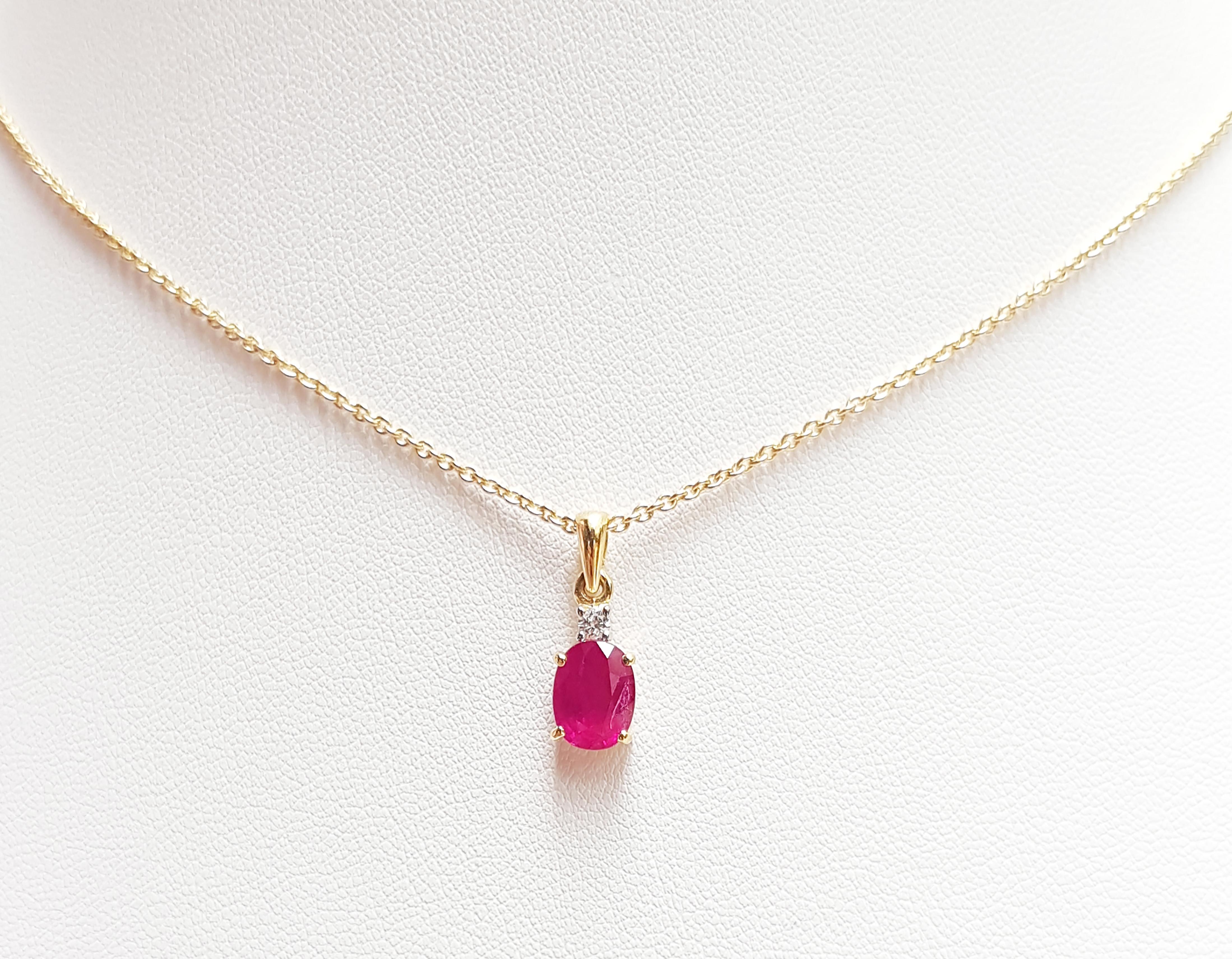 Ruby 1.68 carats with Diamond 0.05 carat Pendant set in 18 Karat Gold Settings
(chain not included)

Width: 0.6 cm 
Length: 1.6 cm
Total Weight: 1.18 grams

