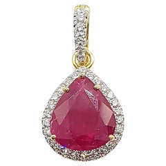 Ruby with Diamond Pendant set in 18 Karat Gold Settings