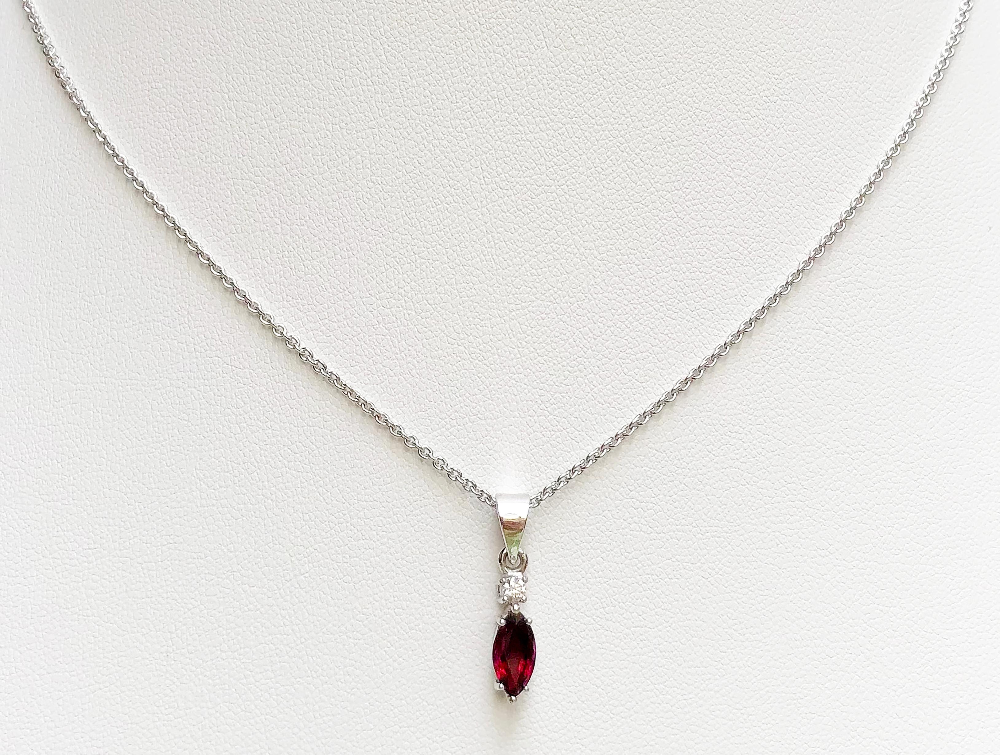 Ruby 1.03 carats with Diamond 0.06 carat Pendant set in 18 Karat White Gold Settings 
(chain not included)

Width:  0.4 cm 
Length: 2.0 cm
Total Weight: 1.45 grams

