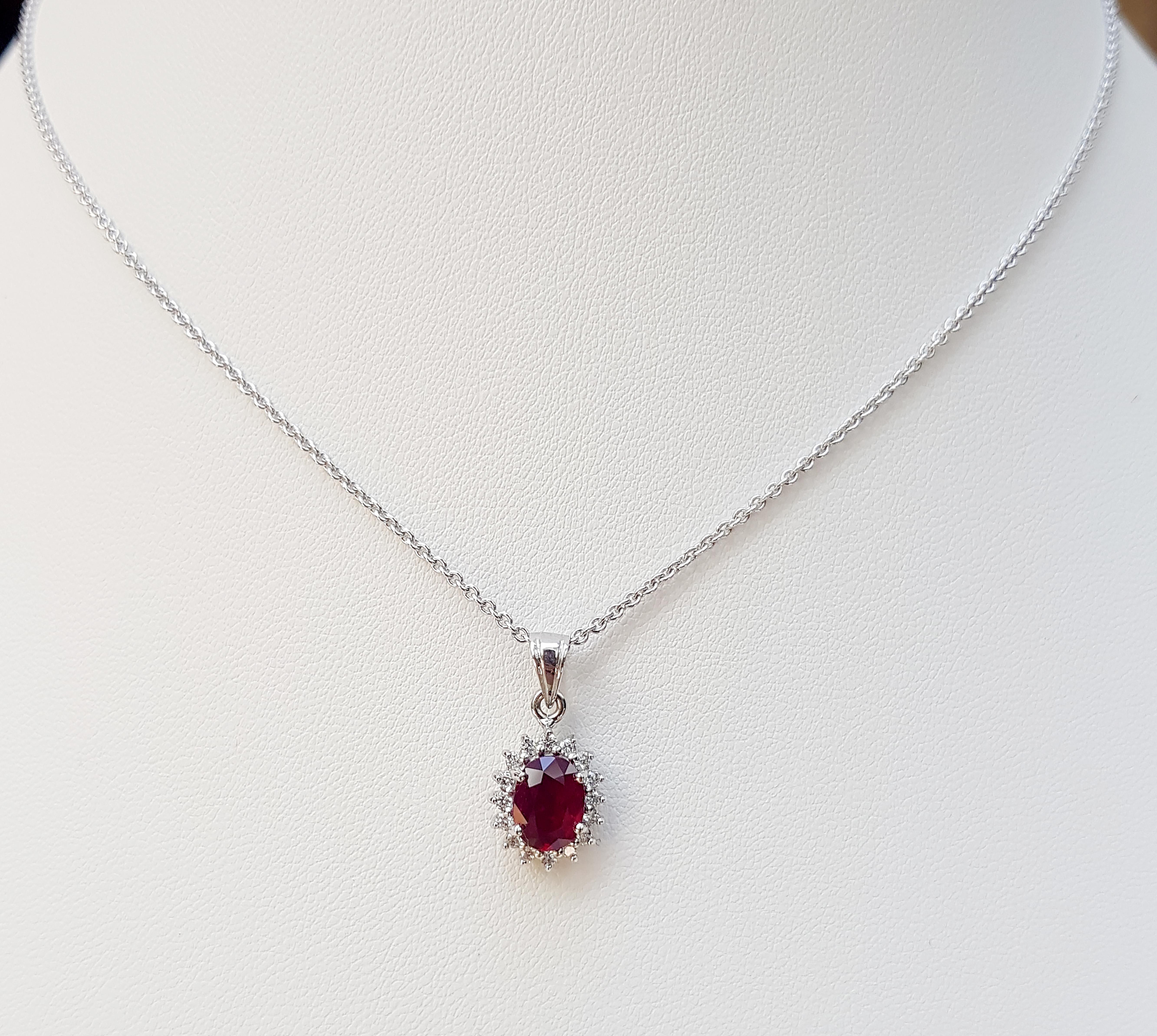 Ruby 1.80 carats with Diamond 0.12 carat Pendant set in 18 Karat White Gold Settings
(chain not included)

Width:  0.6 cm 
Length: 1.8 cm
Total Weight: 1.95 grams

