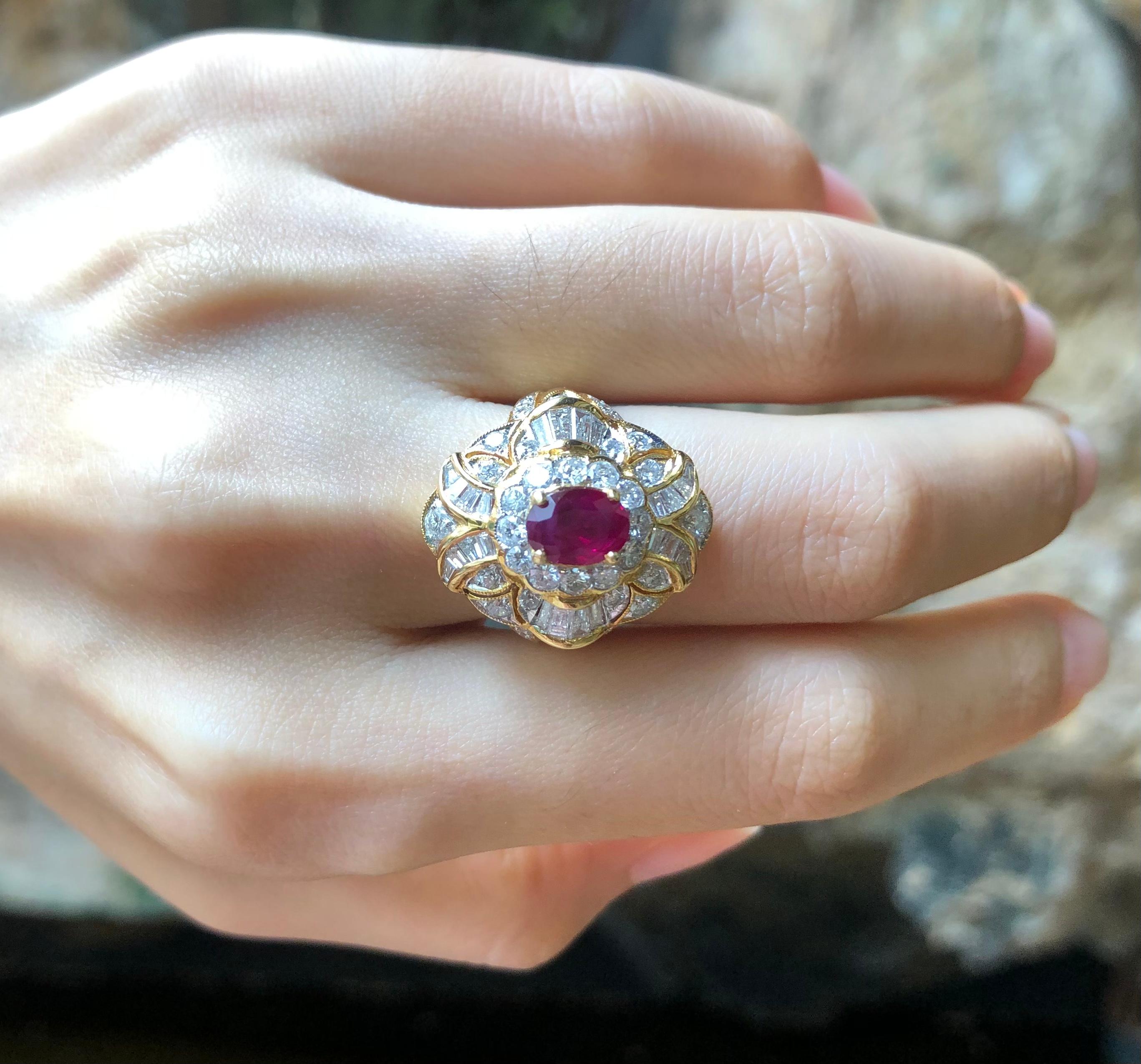 Ruby 1.21 carats with Diamond 1.20 carats Ring set in 18 Karat Gold Settings

Width:  1.4 cm 
Length:  2.2 cm
Ring Size: 52
Total Weight: 8.91 grams

