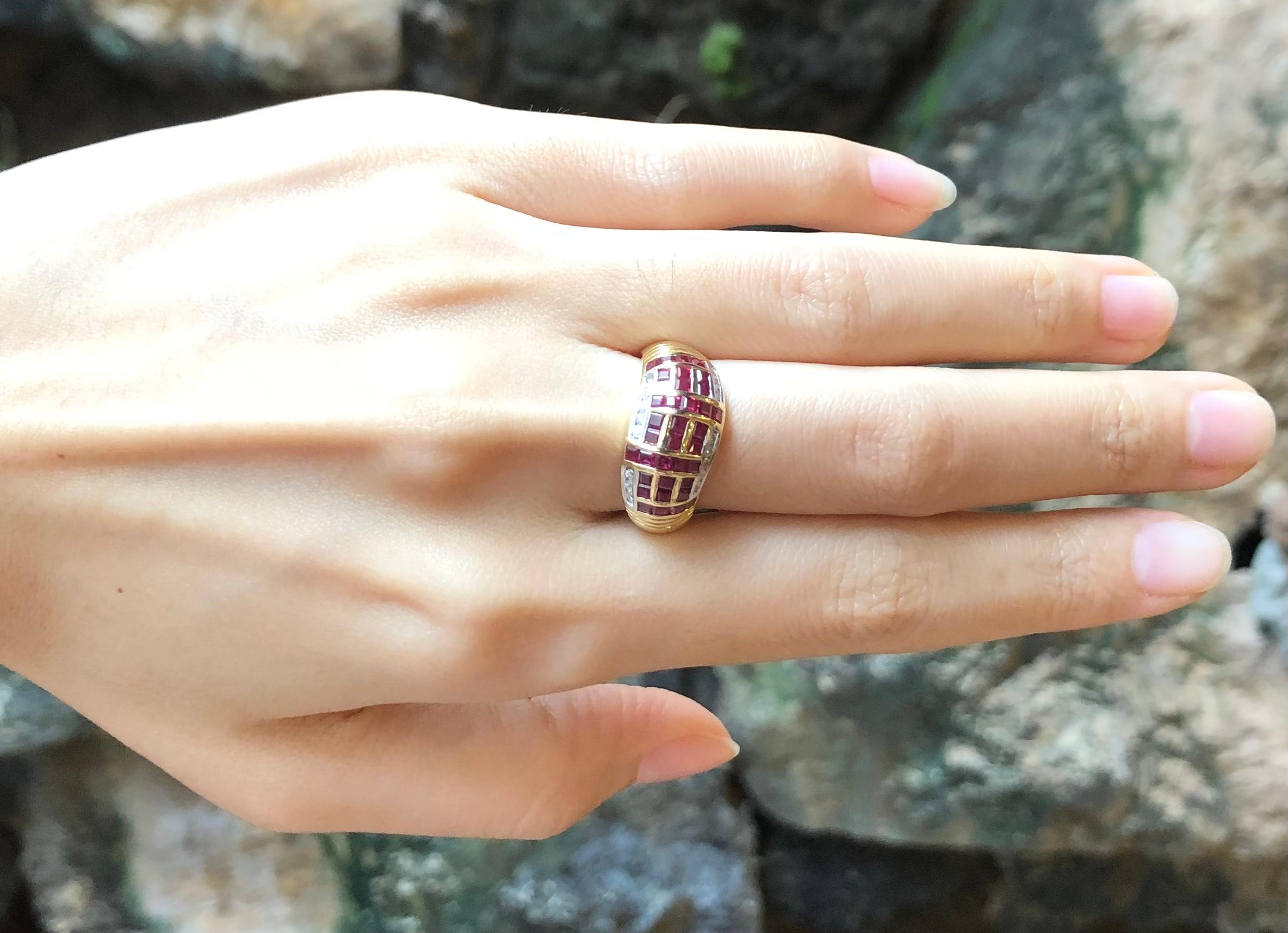 Bague en or 18 carats sertie d'un rubis de 1,85 carat et d'un diamant de 0,23 carat

Largeur :  1.7 cm 
Longueur : 1,0 cm
Taille de l'anneau : 54
Poids total : 5,65 grammes

