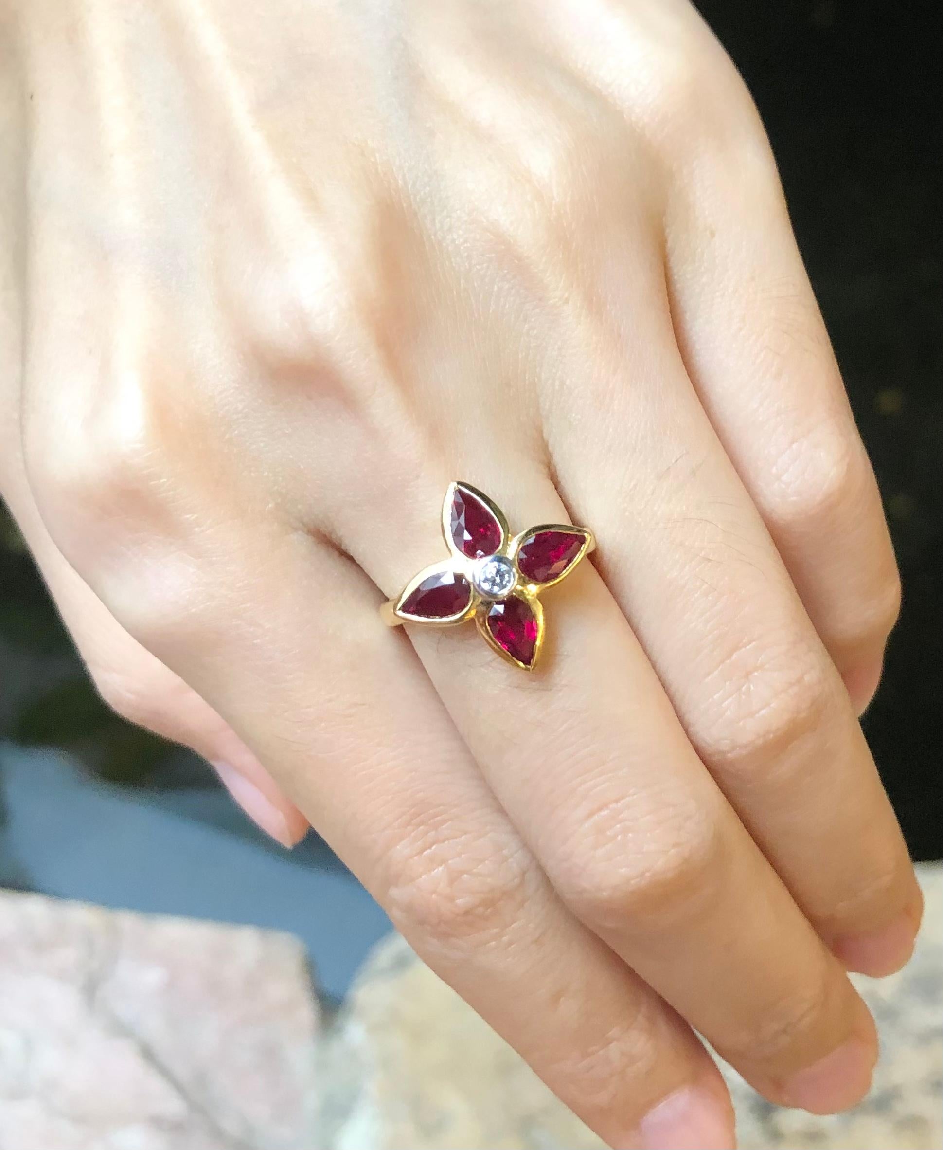 Pear Cut Ruby with Diamond Ring Set in 18 Karat Gold Settings For Sale