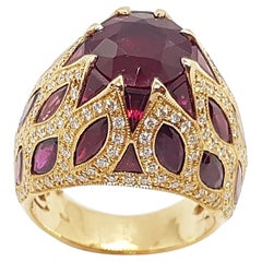 Bague en or rose 18 carats sertie de rubis et de diamants