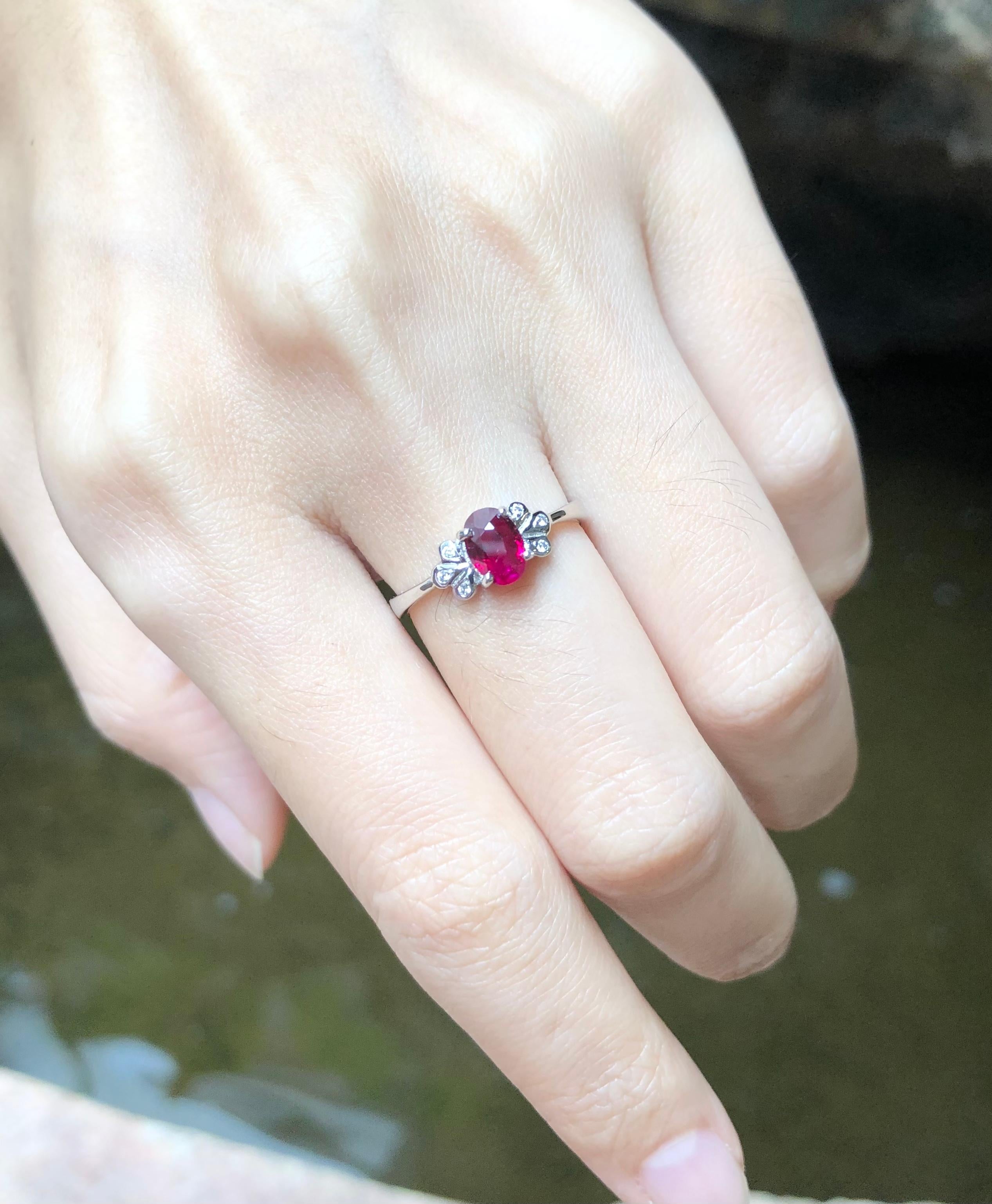 Ruby 0.71 carat with Diamond 0.03 carat Ring set in 18 Karat White Gold Settings

Width:  1.0 cm 
Length: 0.6 cm
Ring Size: 53
Total Weight: 2.36 grams

Ruby 
Width:  0.5 cm 
Length: 0.6 cm

