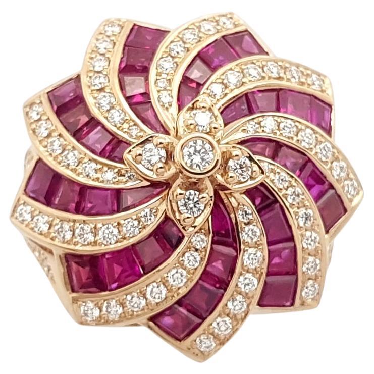 Bague en or rose 18 carats sertie de rubis et de diamants