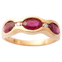 Anello con rubino e diamante con montatura in oro rosa 18K