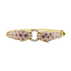 Bracelet panthère en or 18 carats, rubis, émeraudes et diamants