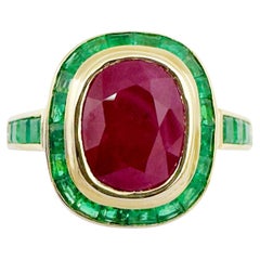 Anillo de Rubí con Esmeralda engastado en Oro de 18K