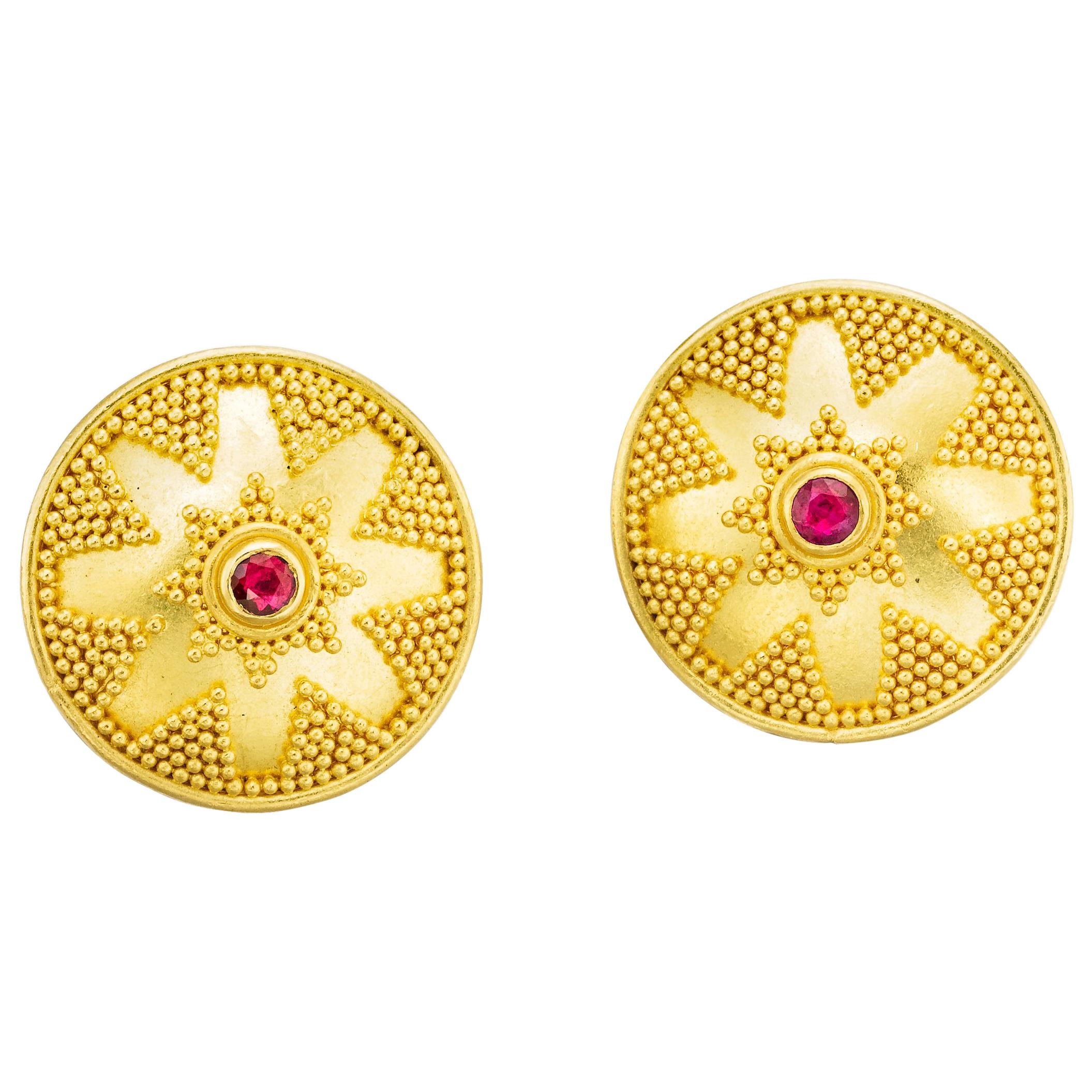 Shield domed earrings in 22 karat gold with granulation and rubies .35carats
posts and omega back clips in 18 Karat gold.

the earrings are 7/8 of an inch diameter
Hand made in NY and one of a kind
