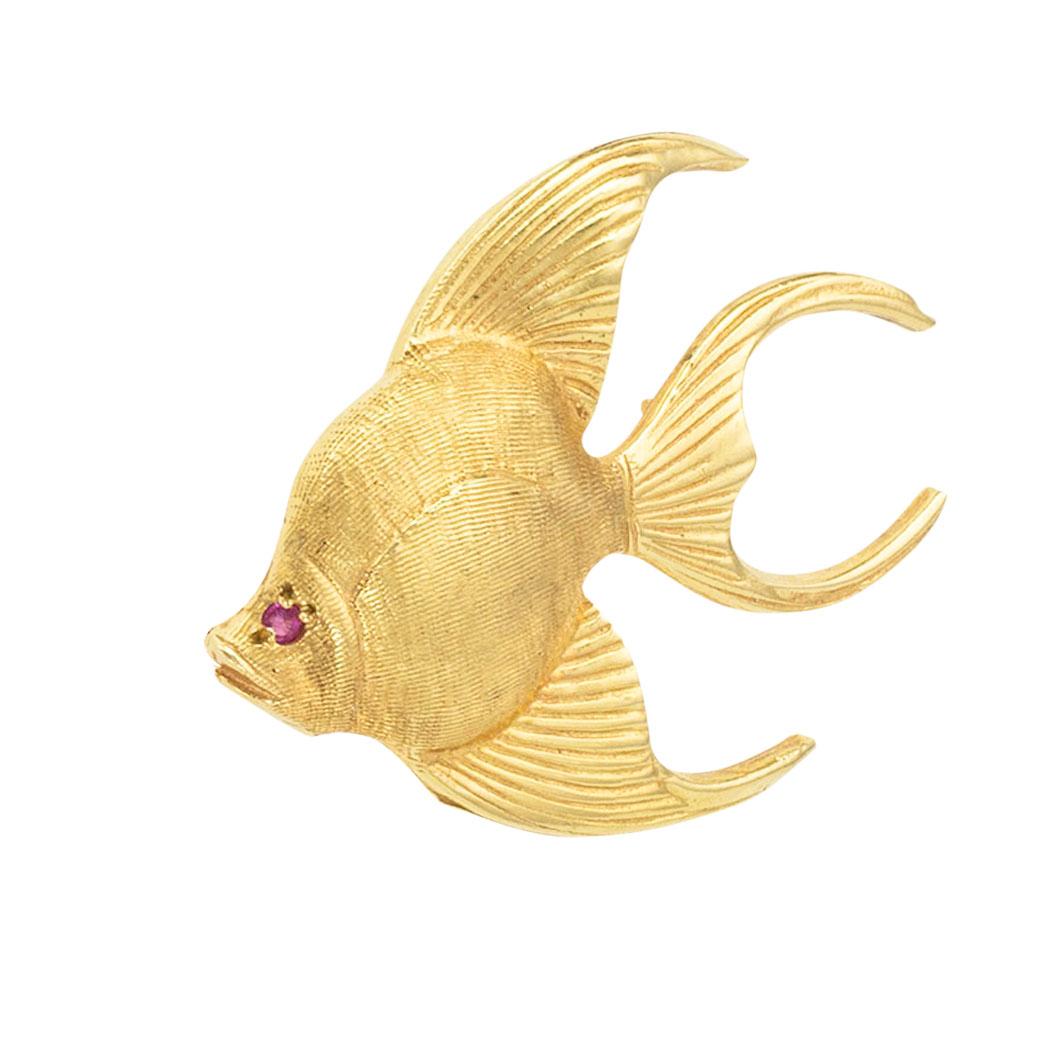 Ruby and gold figural angelfish brooch circa 1960. *

ABOUT THIS ITEM:  #P-DJ912G. Scroll down for specifications.  Depicting an angel fish with fins and tail gently slanted suggesting that it is in a swimming motion, its body highlighted by flowing