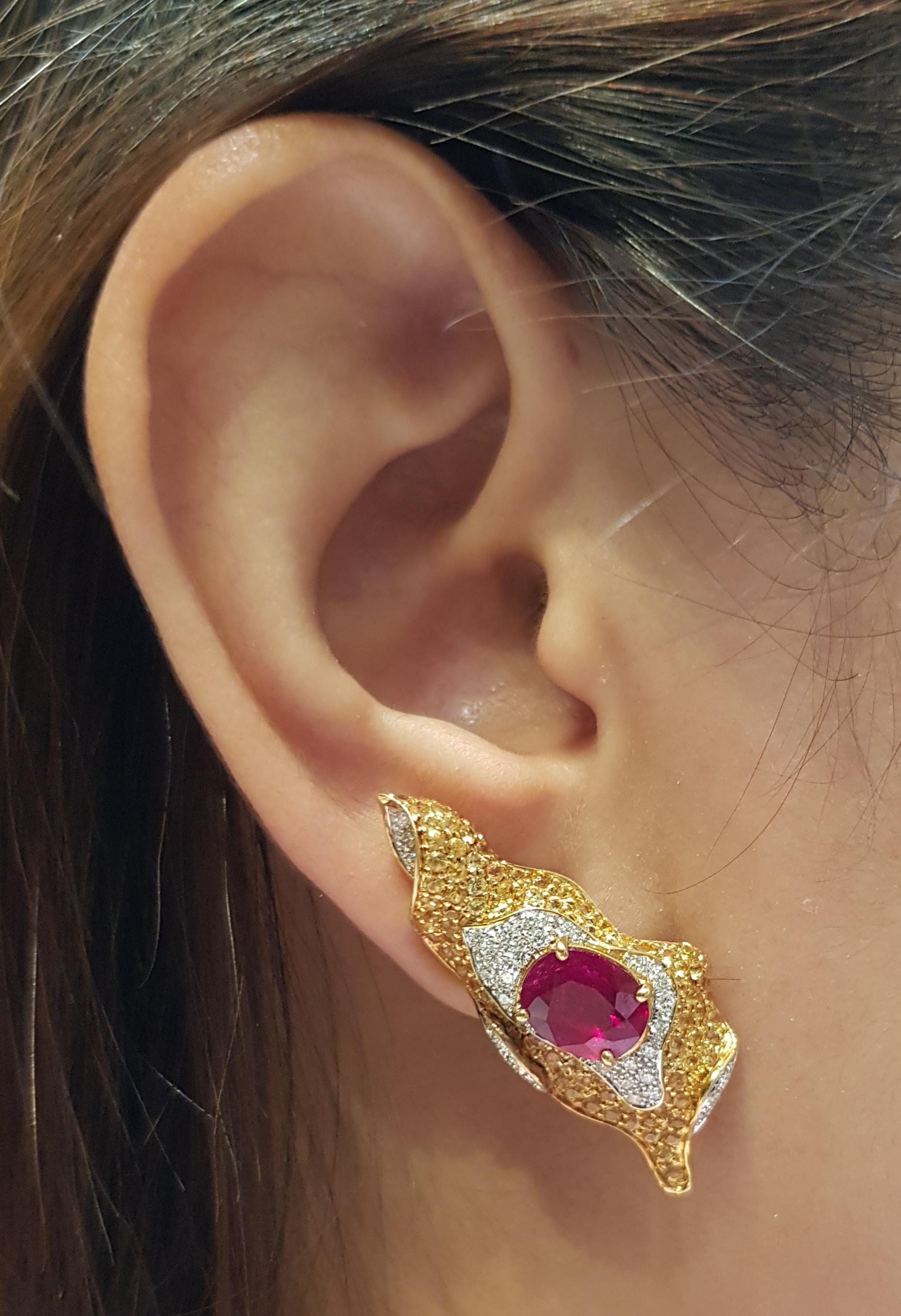 Ruby 3.88 carats with Yellow Sapphire 3.09 carats and Diamond 0.58 carat Earrings set in 18 Karat Gold Settings

Width:  1.5 cm 
Length:  3.8 cm
Total Weight: 13.95 grams

