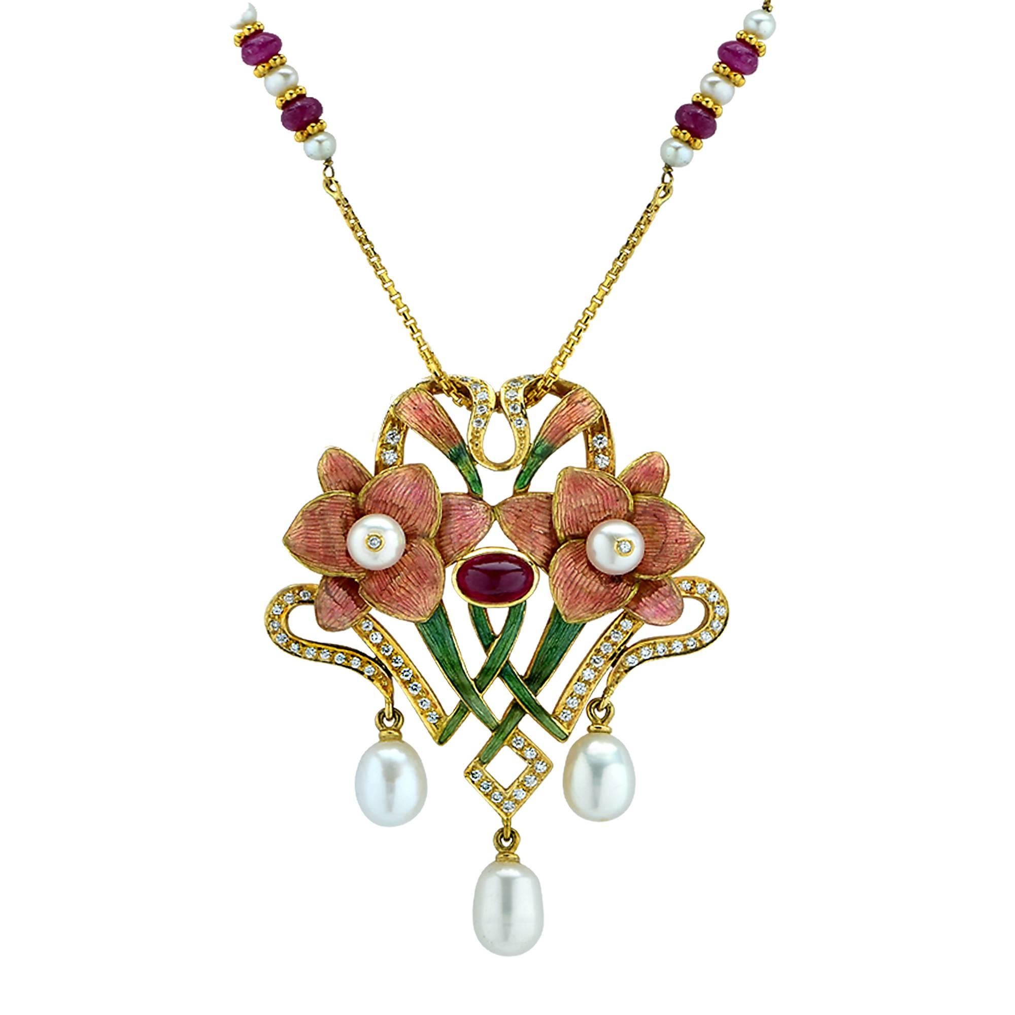 This artistically crafted 18k Yellow Gold necklace and earring set is a true work of art. Enamel, pearls, rubies and approximately .50cts of round brilliant cut diamonds G color VS clarity are expertly combined and crafted into a pendant and earring